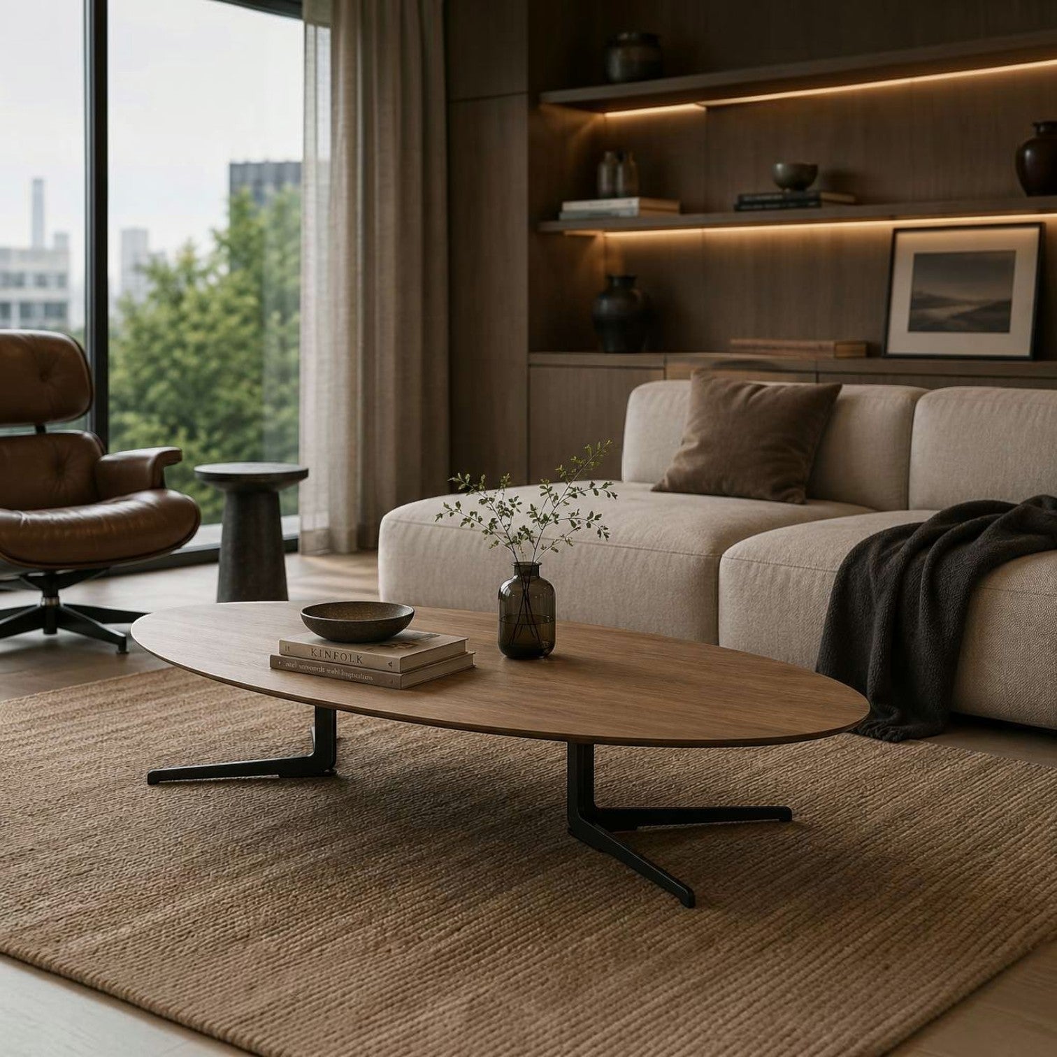 Addo Shop Flamingo low oval coffee table with natural veneer top and black metal twin-base in a modern living room.