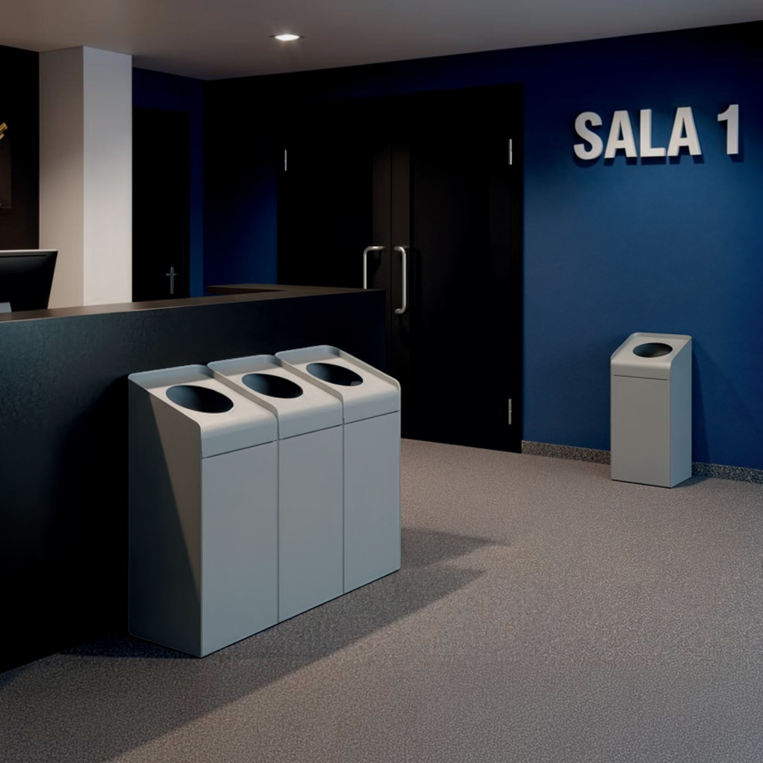 Addo Shop Riciclo Curve 70L grey metal recycling bins with circular openings in a modern office lobby setting.