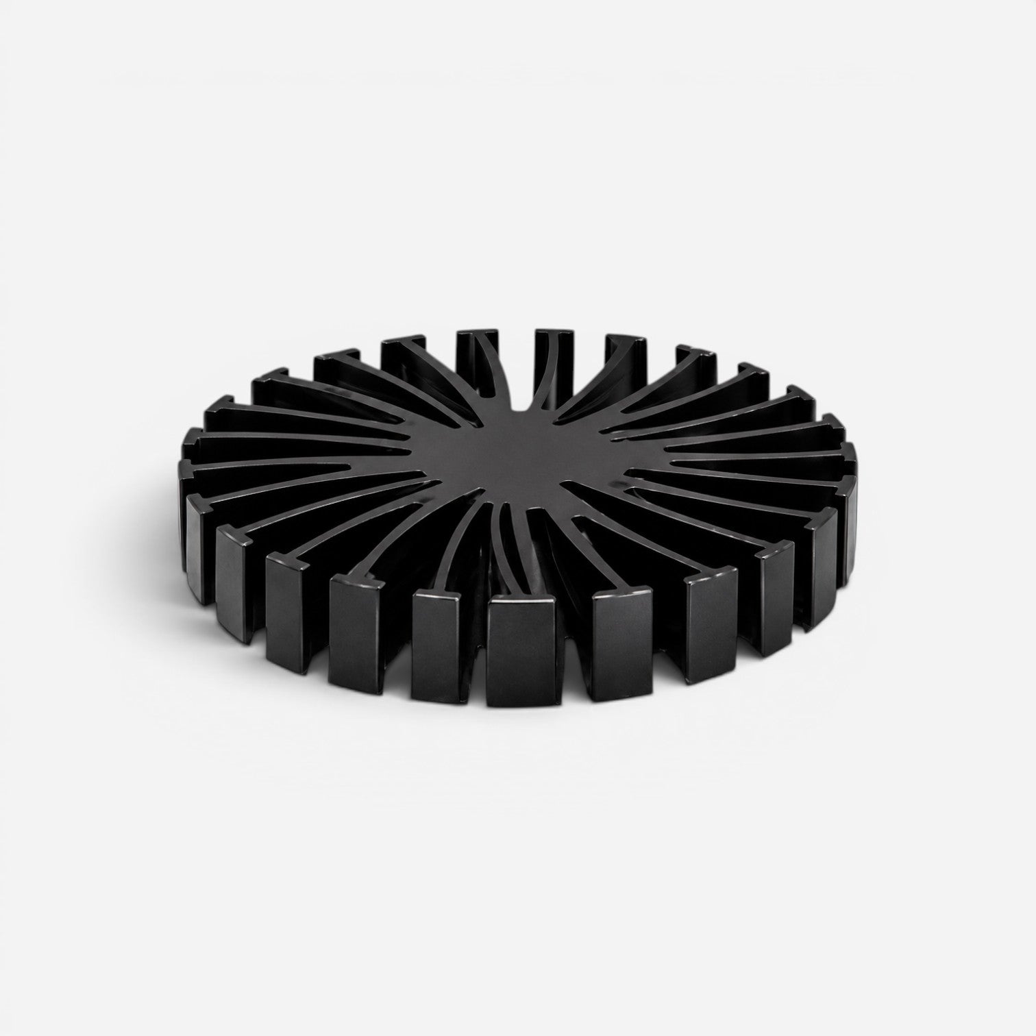 Addo Shop black circular decorative tray with a radial ribbed design on a white background