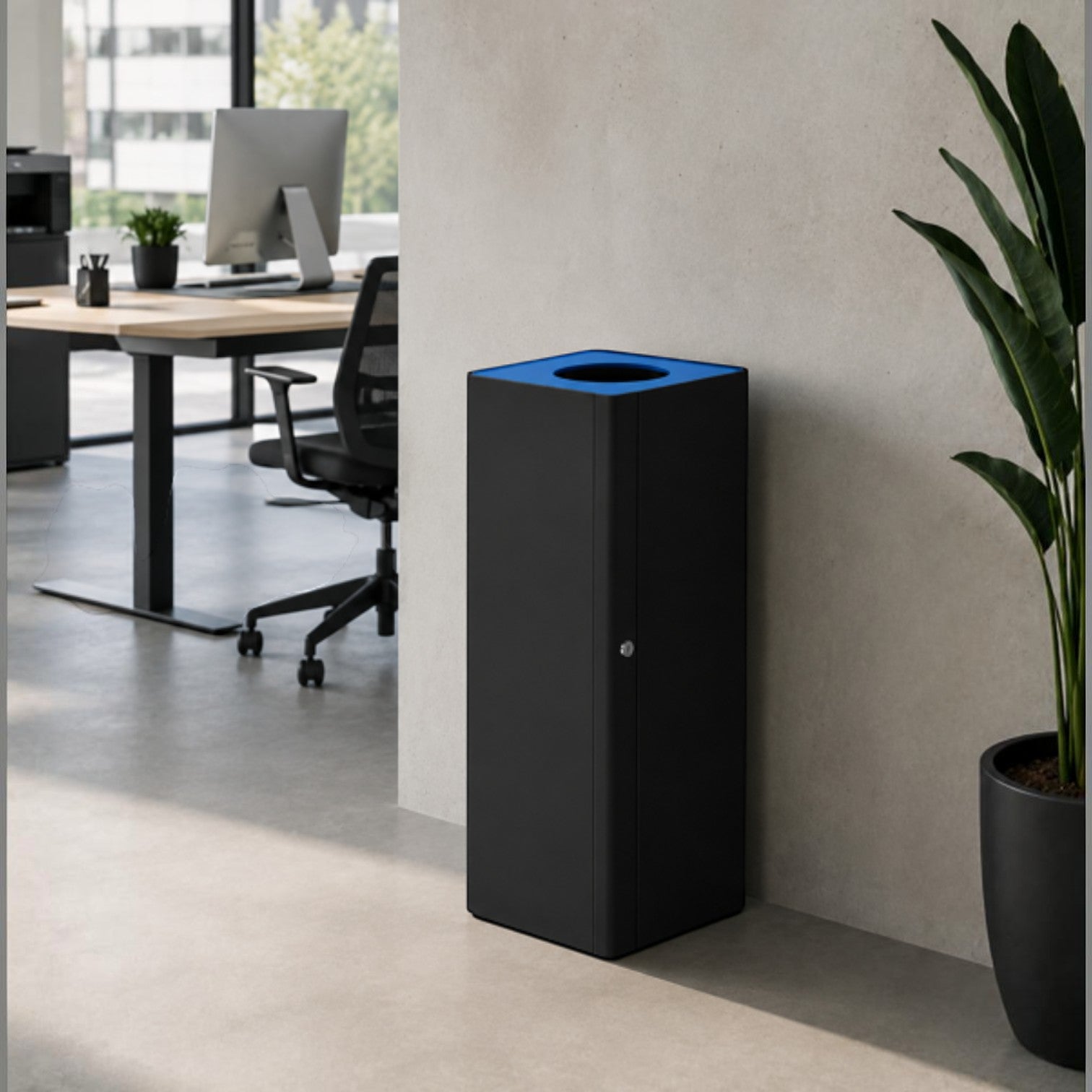 Addo Shop Centolitri Lock 100L recycling bin in matte black with a blue top, placed in a modern office setting.