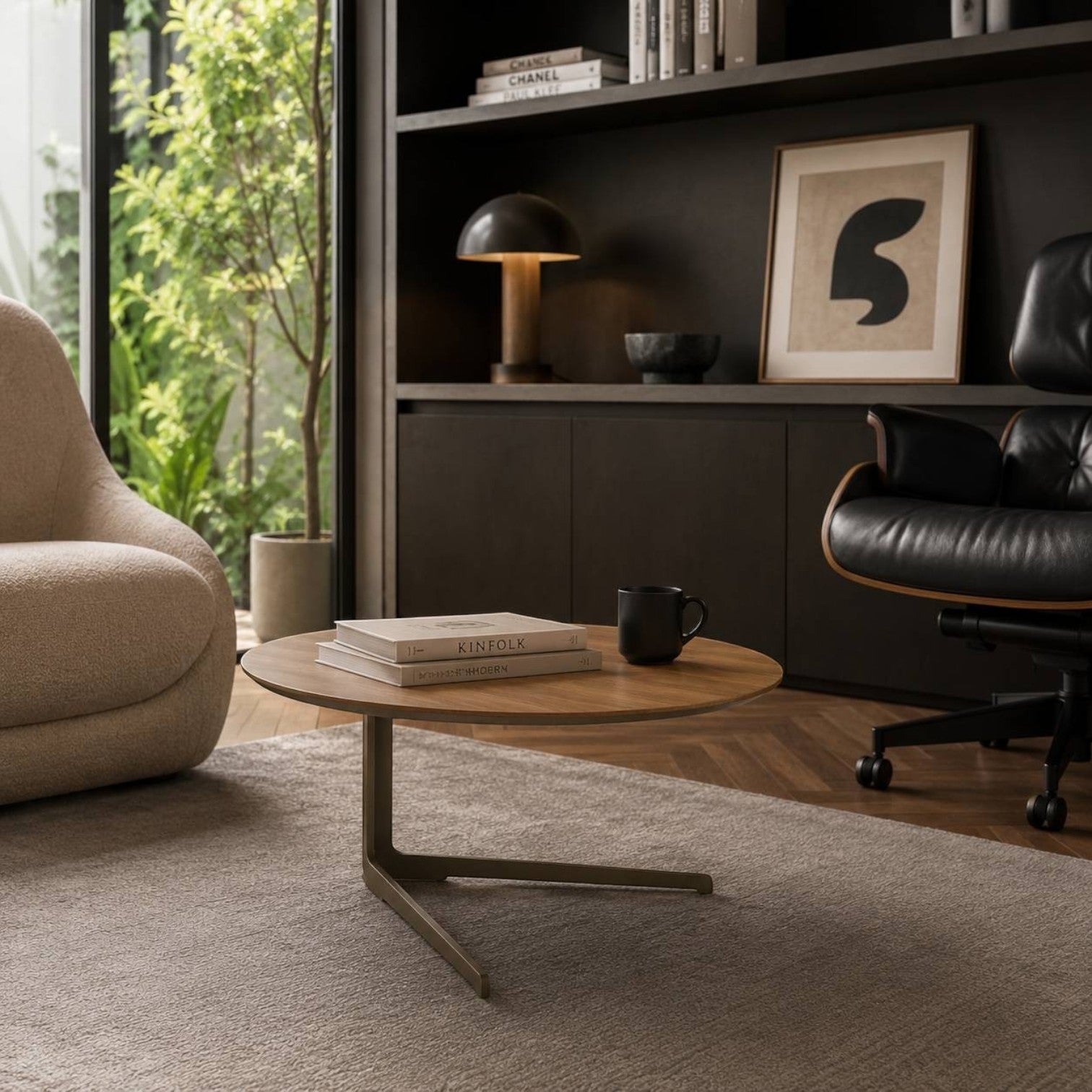 Addo Shop Flamingo large round coffee table with natural veneer top and metal twin-base in a modern lounge setting.