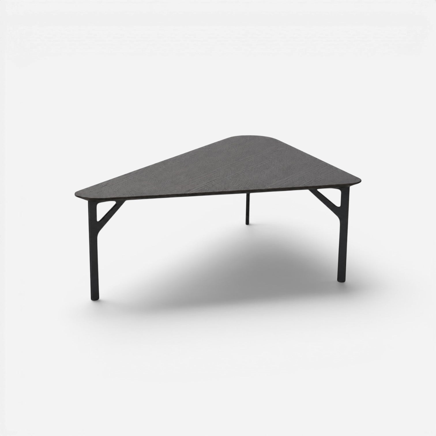 Addo Shop Fly triangular coffee table with a dark wood veneer top and slim black powder-coated metal three-leg base.
