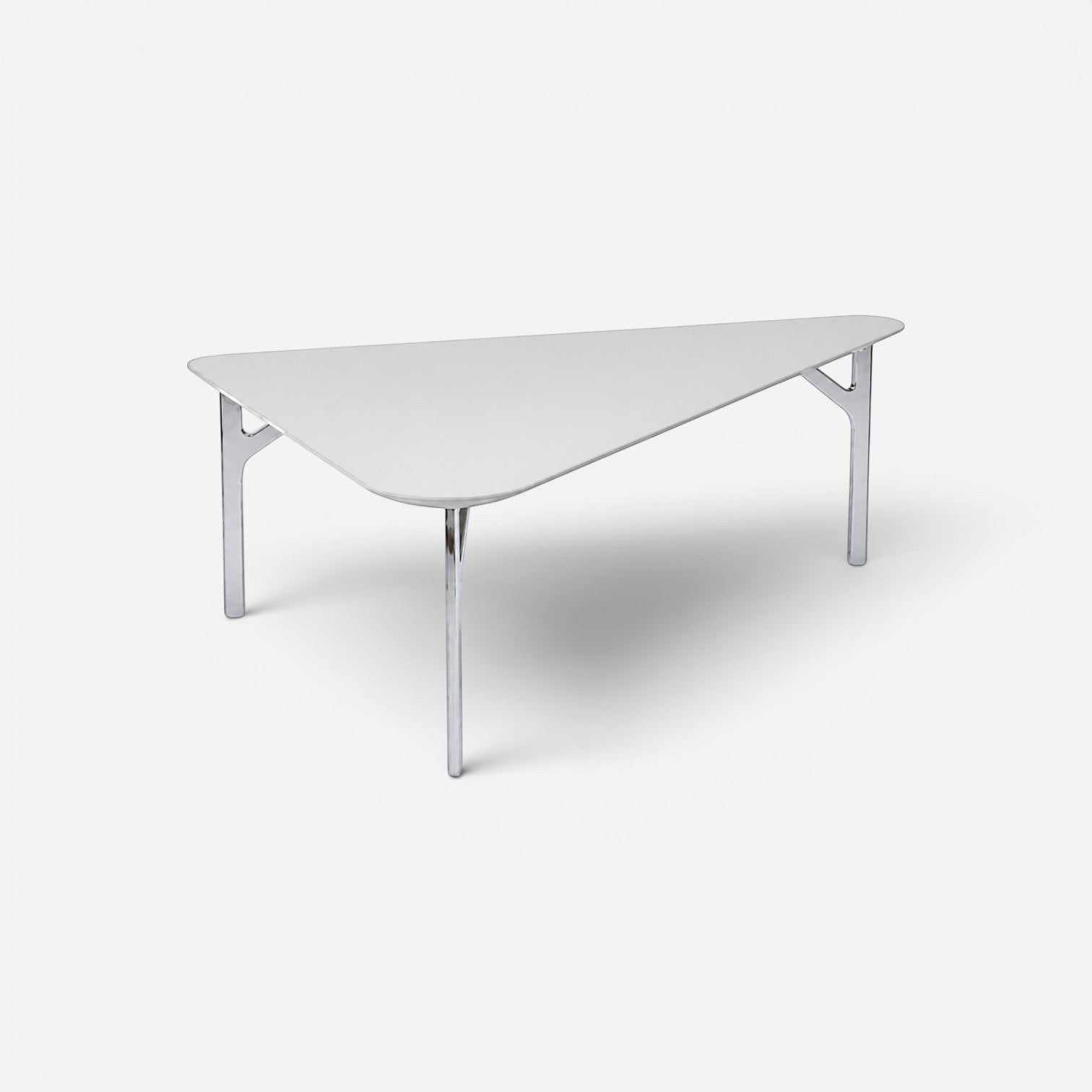 Addo Shop Fly triangular coffee table with a white tabletop and slim metallic three-leg base for modern interiors.