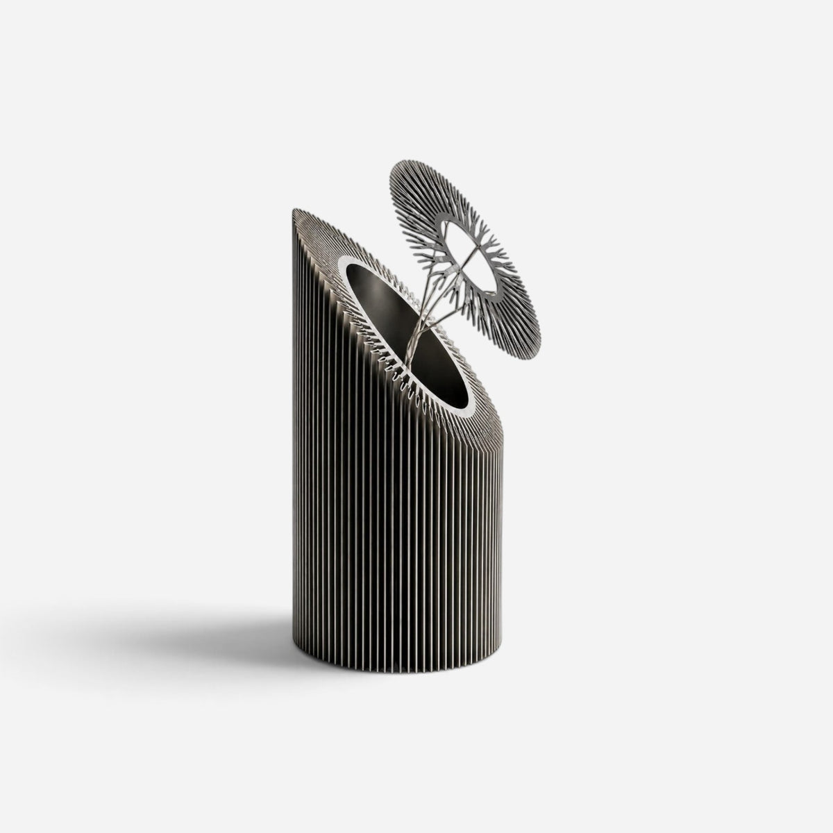 Addo Shop HELIO-2 sculptural decorative object made of brushed aluminum with a floral-inspired industrial design.