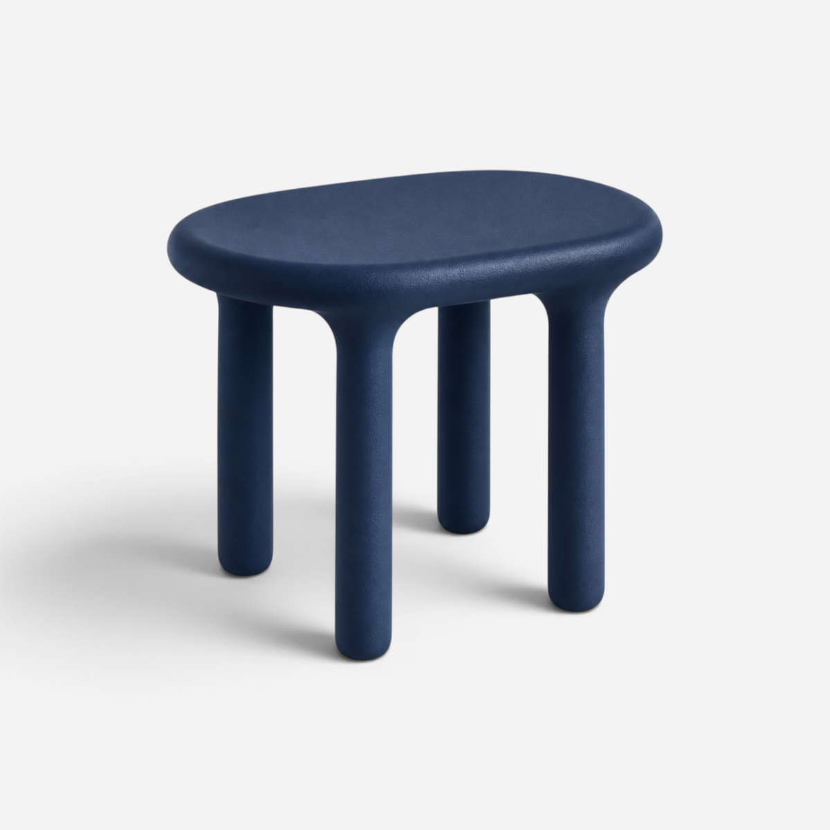 Addo Shop Kidzdesk01 Tabure, a minimalist navy blue stool with a smooth, rounded oval seat and four sturdy legs.