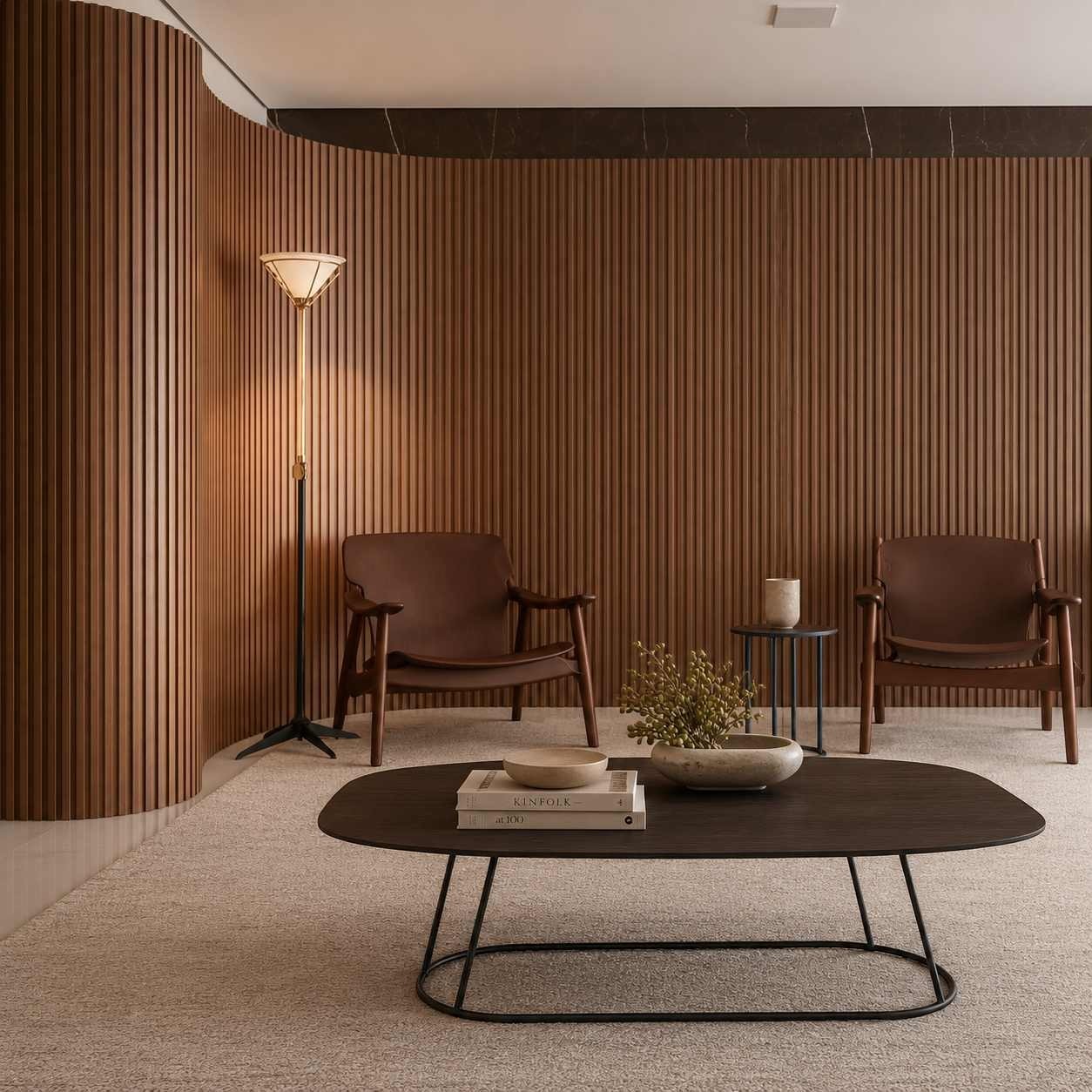 Addo Shop Kiran oval coffee table with dark Alpi veneer top and geometric metal base in a modern lounge setting