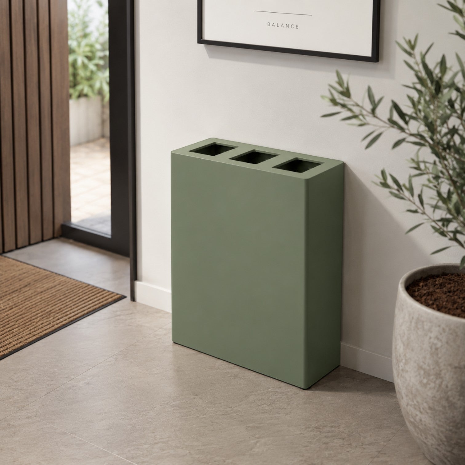Addo Shop Maximo 150L sage green recycling bin with three top openings in a modern minimalist home interior.