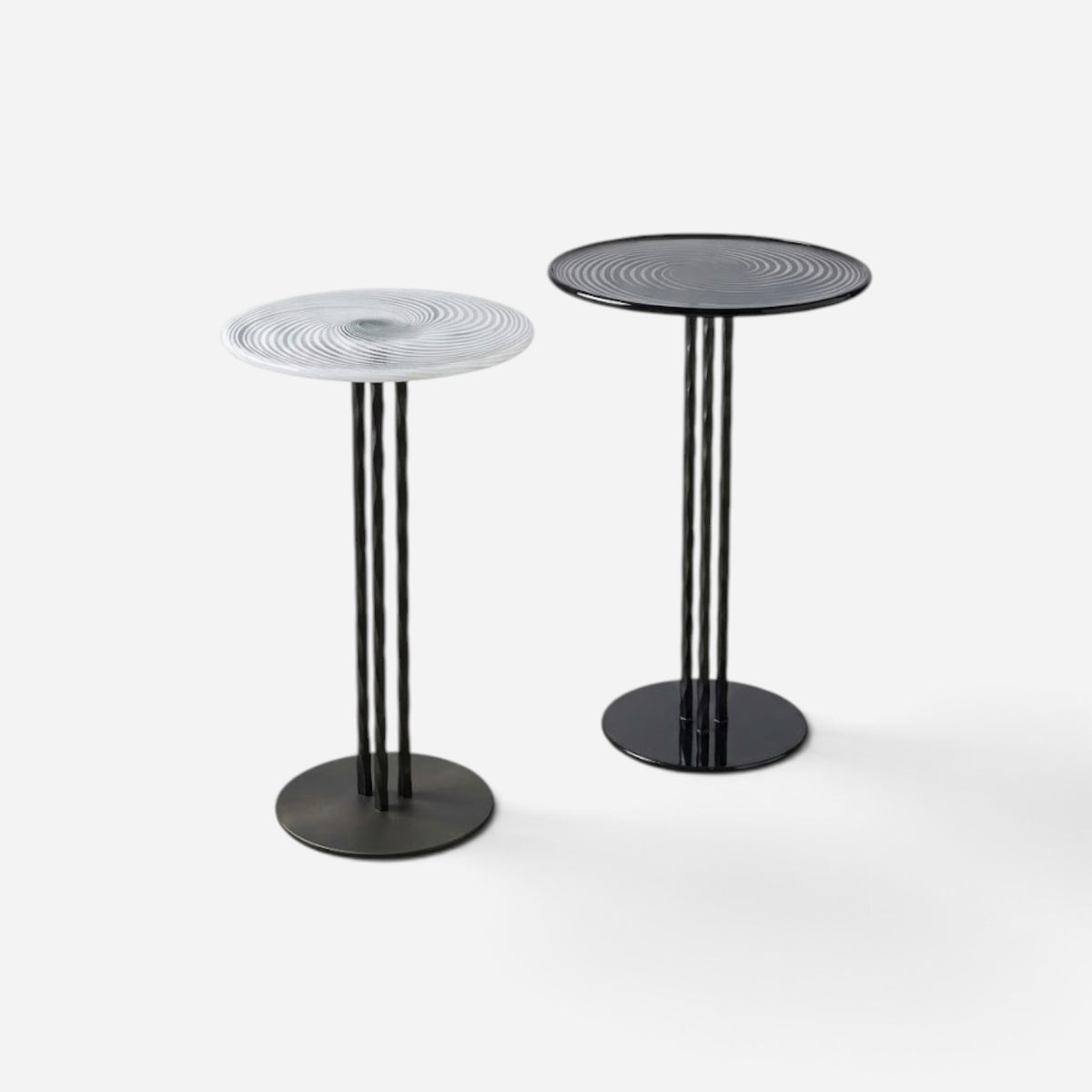 Addo Shop NAVIN duo side table set featuring one white and one black circular table with spiral patterns and metal legs