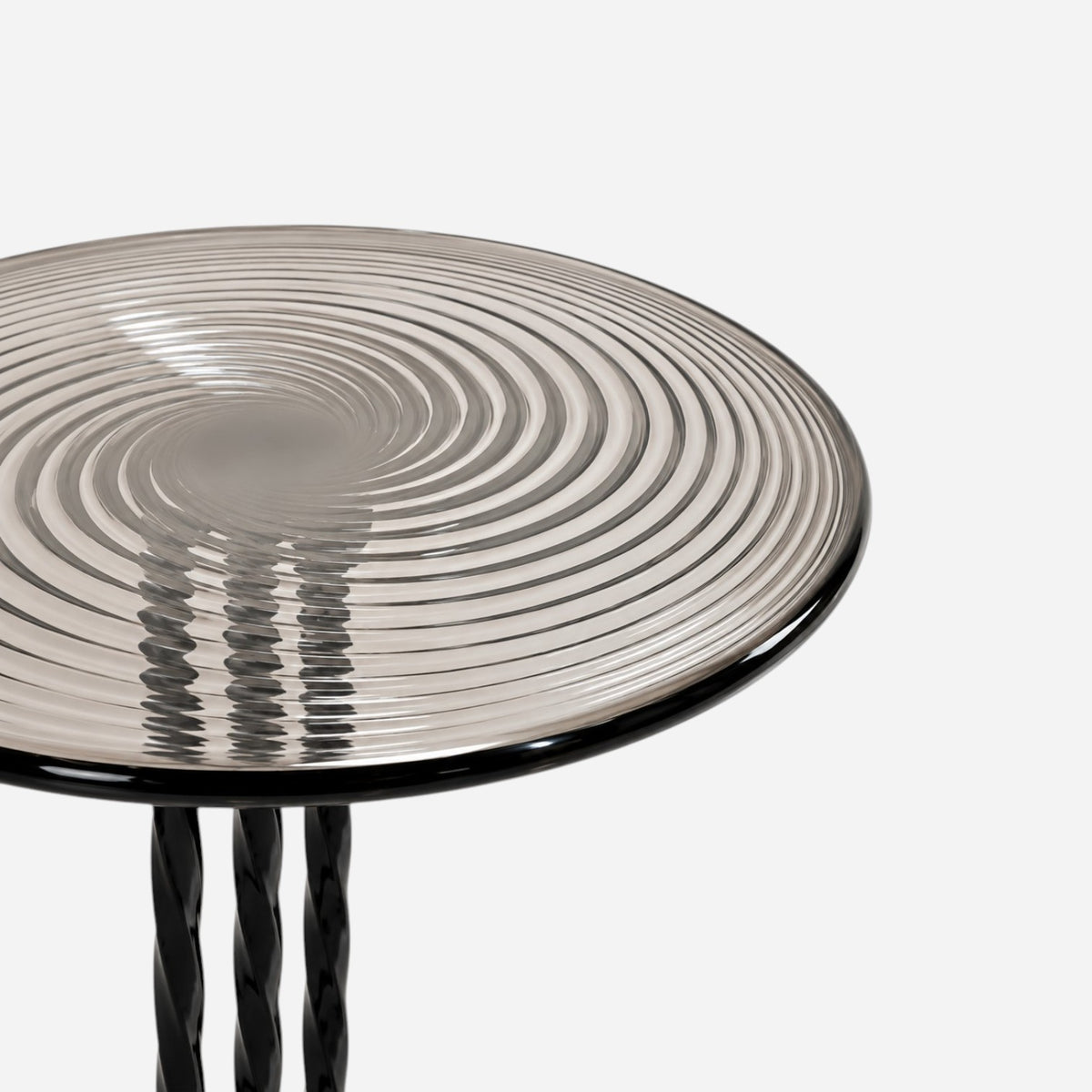 Addo Shop NAVIN Duo side table featuring a circular smoked glass top with a swirling spiral pattern and twisted base