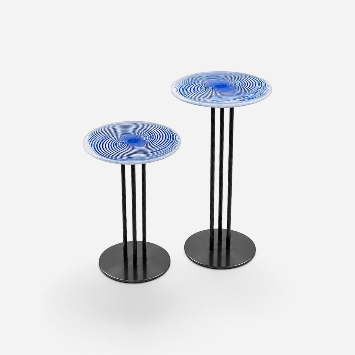 Addo Shop NAVIN duo side table set featuring blue and white swirl glass tops and slim black metal legs.