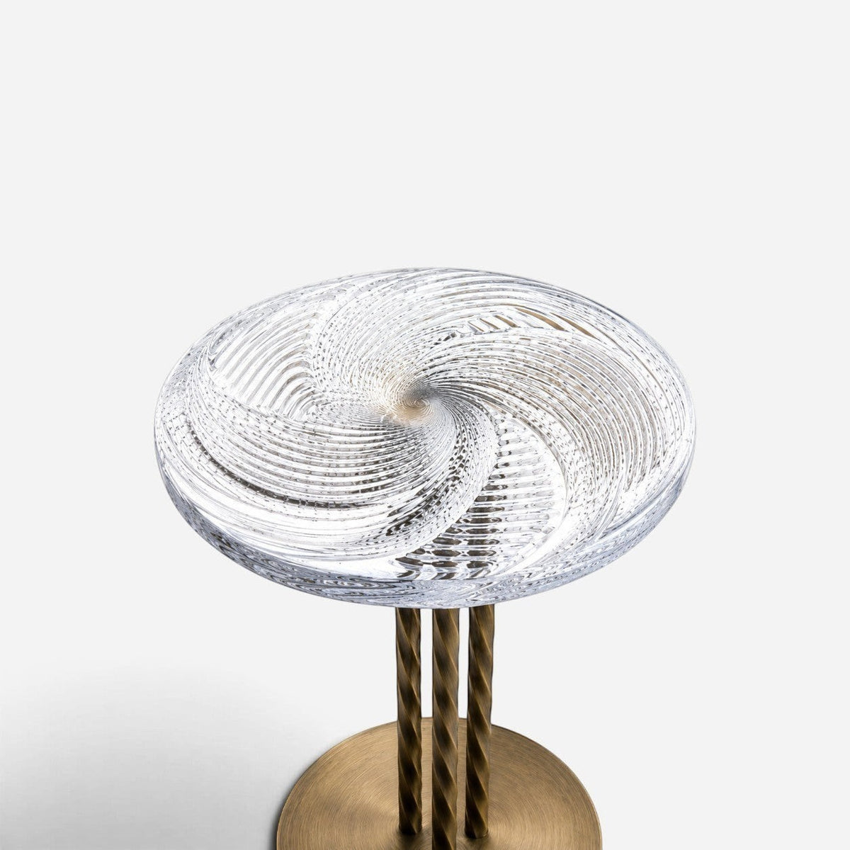 Addo Shop NAVIN Orta side table with a handcrafted spiral Cesm-i Bulbul glass top and a brushed bronze metal base.