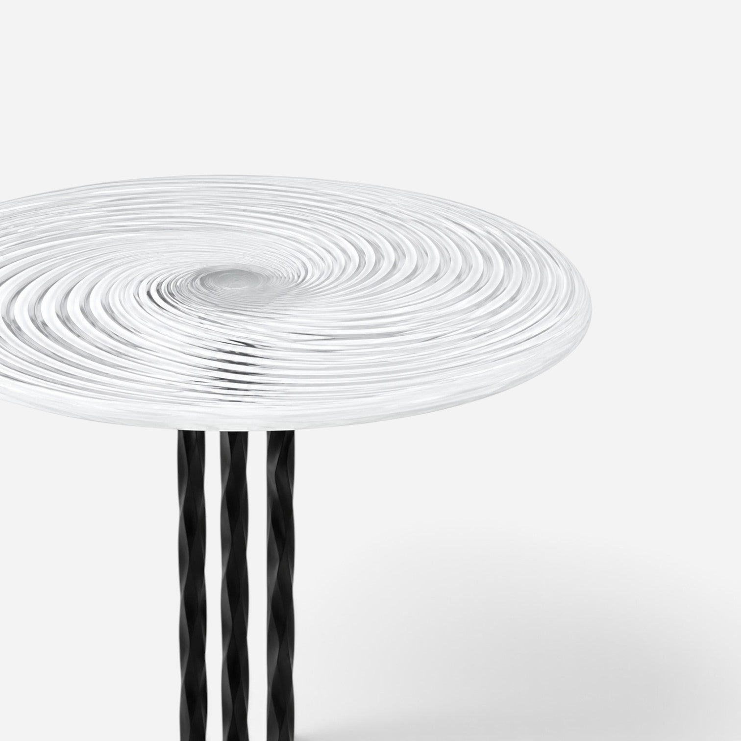 Addo Shop NAVIN duo side table featuring a clear glass top with a spiral pattern and black twisted metal legs.