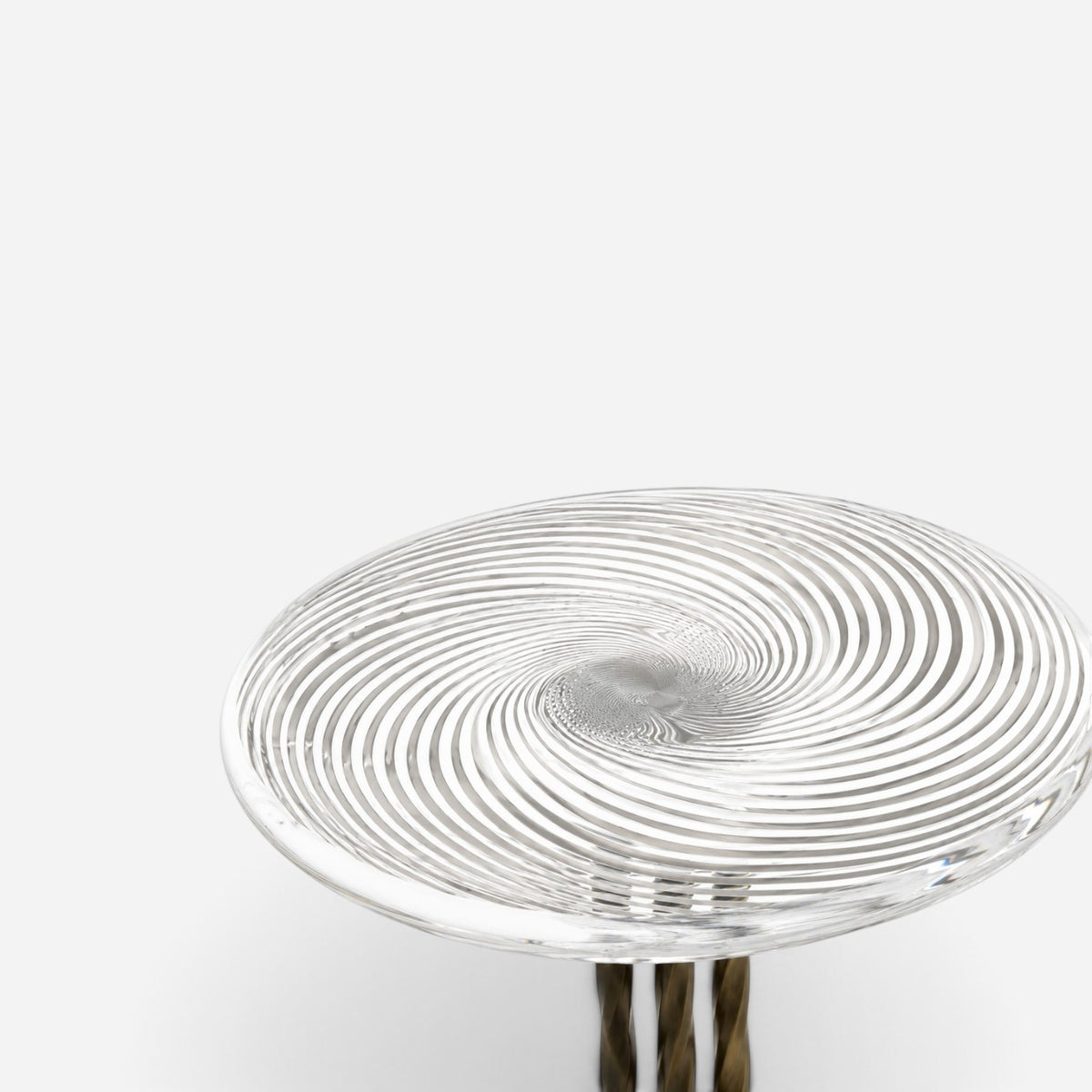 Addo Shop NAVIN duo side table set with a clear glass top featuring a swirling spiral pattern and metallic base