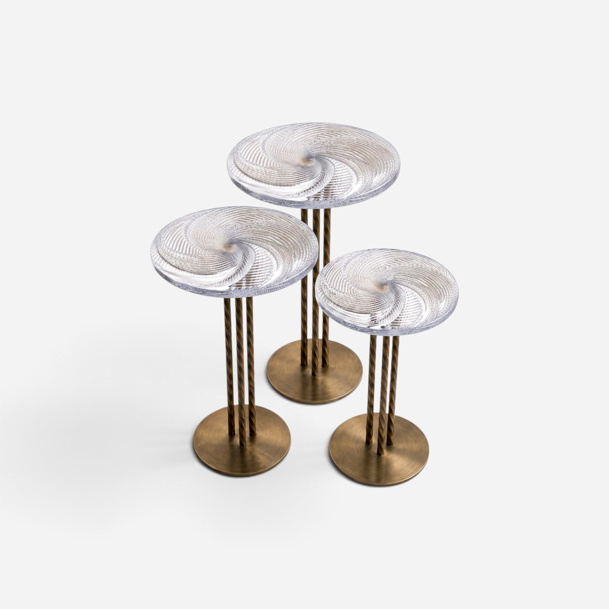 Addo Shop NAVIN trio nesting coffee table set with clear swirl glass tops and brushed gold metal pedestal bases