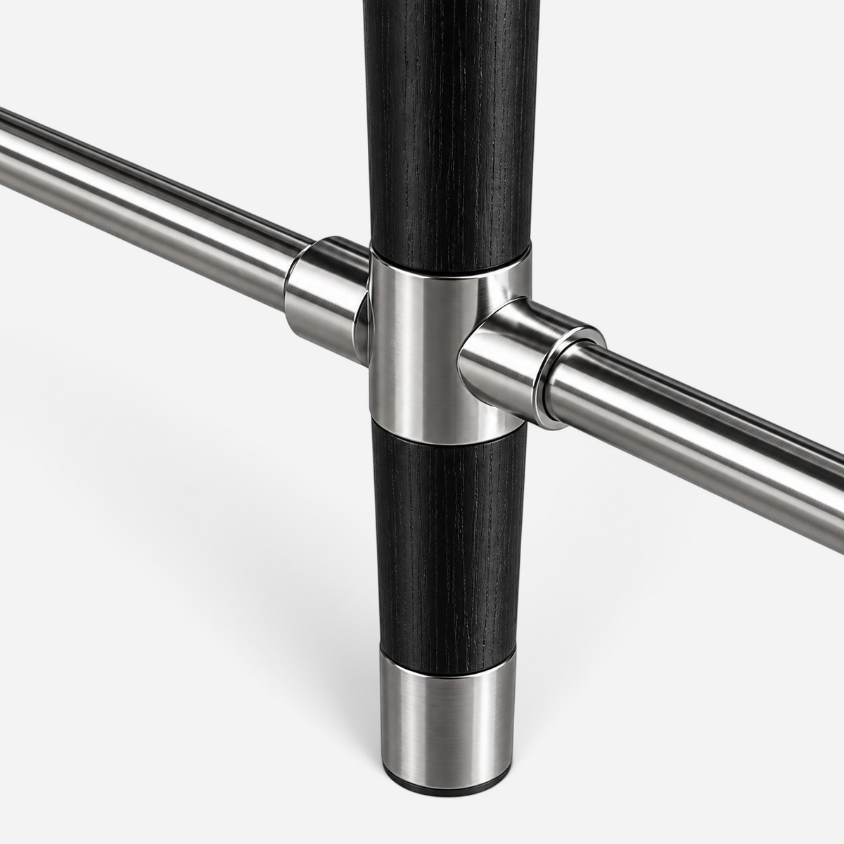 Addo Shop ODAK DÜĞÜM furniture leg detail featuring black wood and brushed stainless steel metal joint connector