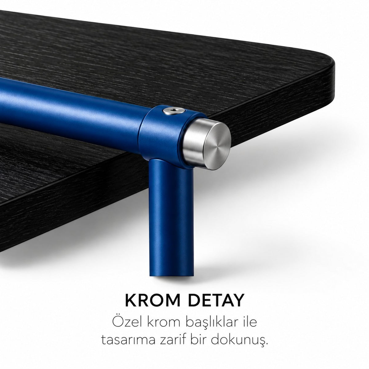 Addo Shop ODAK KURGU desk featuring a dark wood surface, cobalt blue metal frame, and refined chrome end cap detail.
