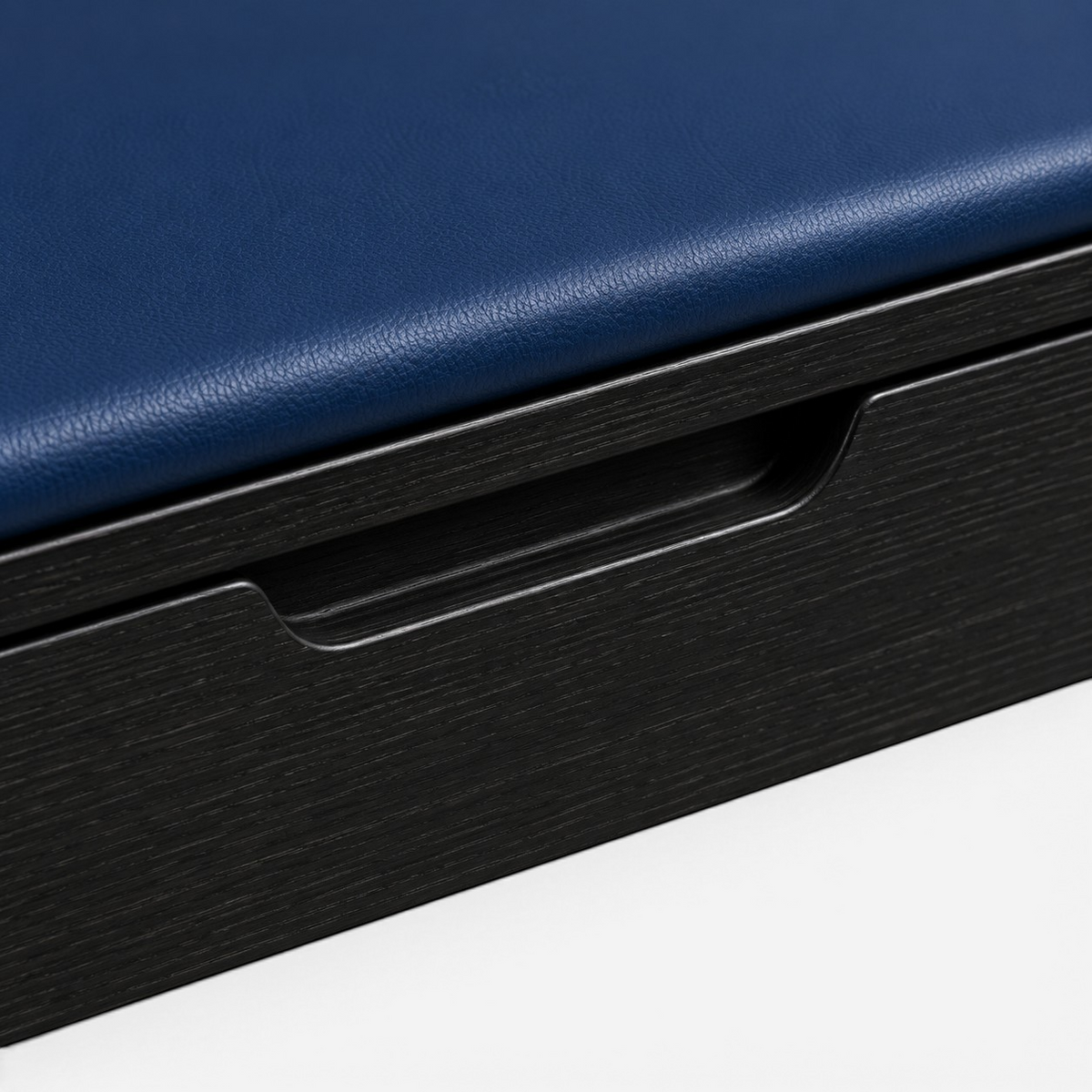 Addo Shop ODAK RAY bench featuring a deep blue leather seat cushion and a black wood grain finish drawer handle