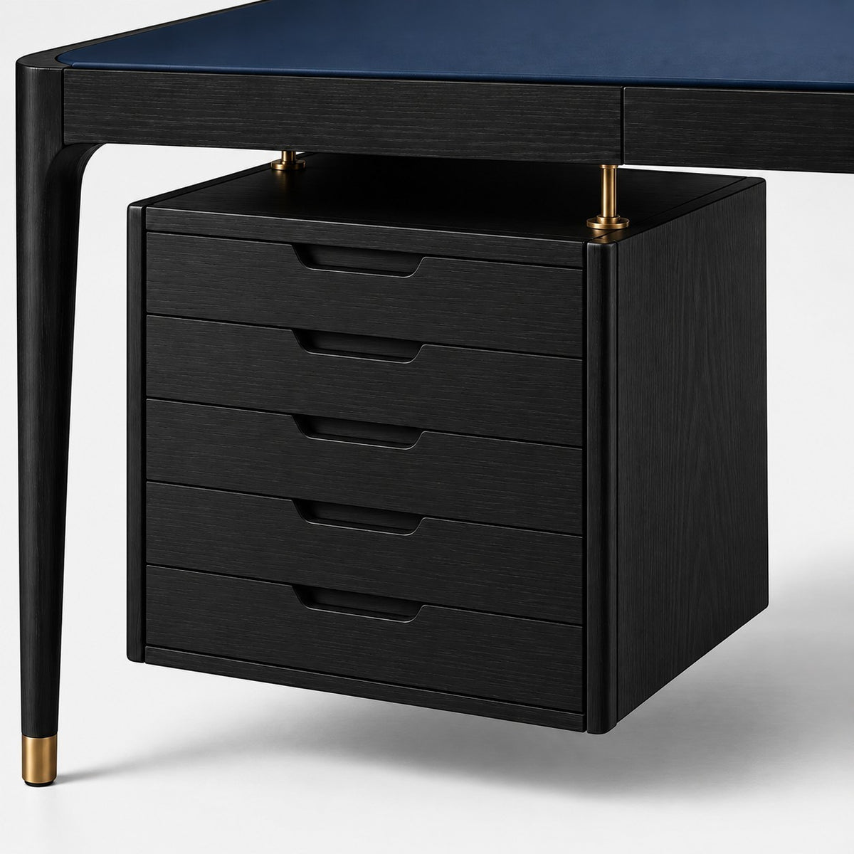 Addo Shop ODAK RAY desk featuring a dark wood hanging five-drawer unit, brass accents, and a navy blue work surface.