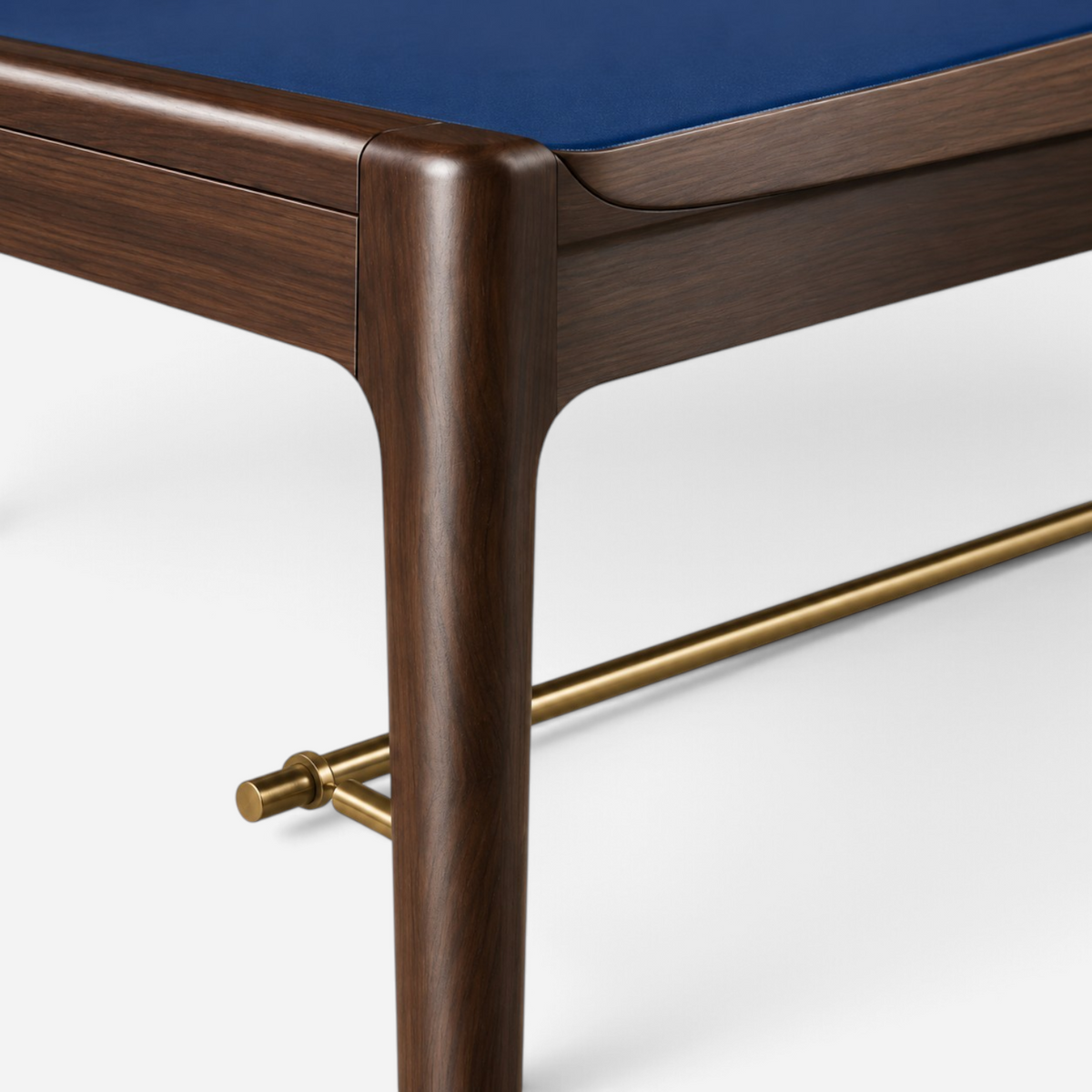 Addo Shop ODAK RAY desk featuring a dark wood frame, blue leather surface, and a sleek brass footrest detail.