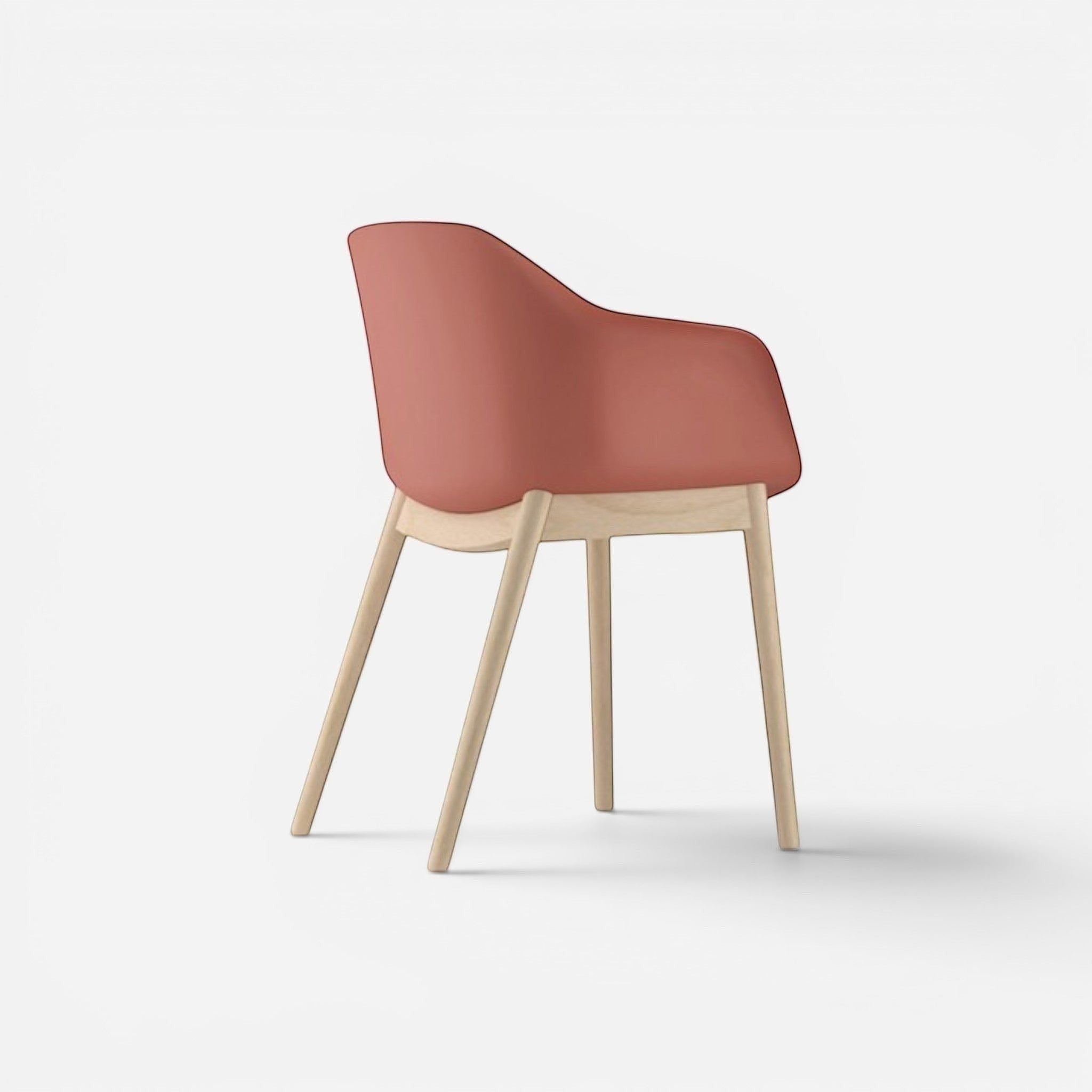 Addo Shop Payal chair with coral plastic seat and back, supported by four light wood legs.