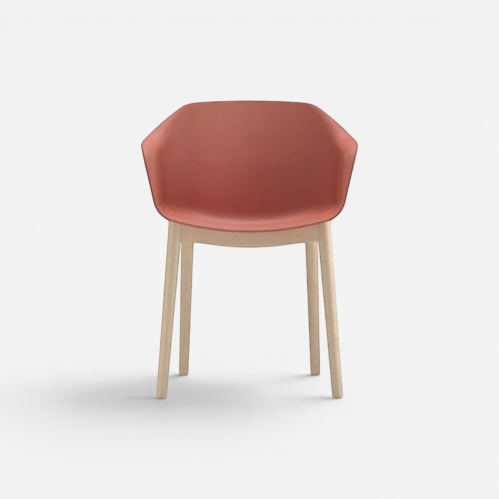 Addo Shop Payal chair with coral plastic seat and back, supported by four light wood legs.