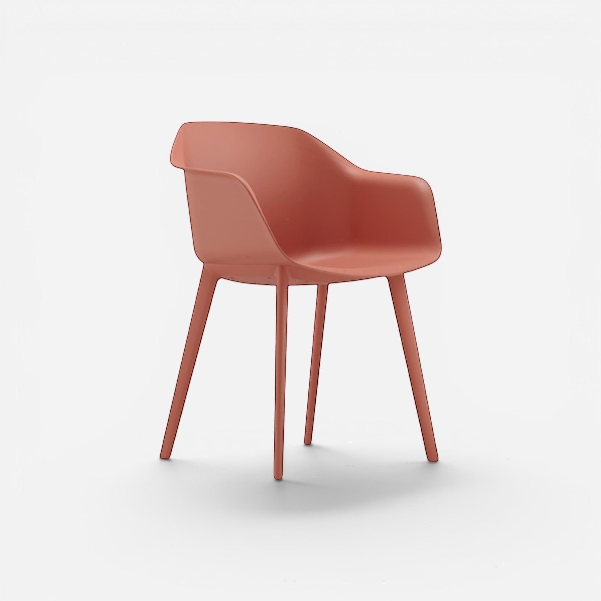 Addo Shop Payal chair with coral plastic seat and back, and four plastic legs. Modern cafe style.