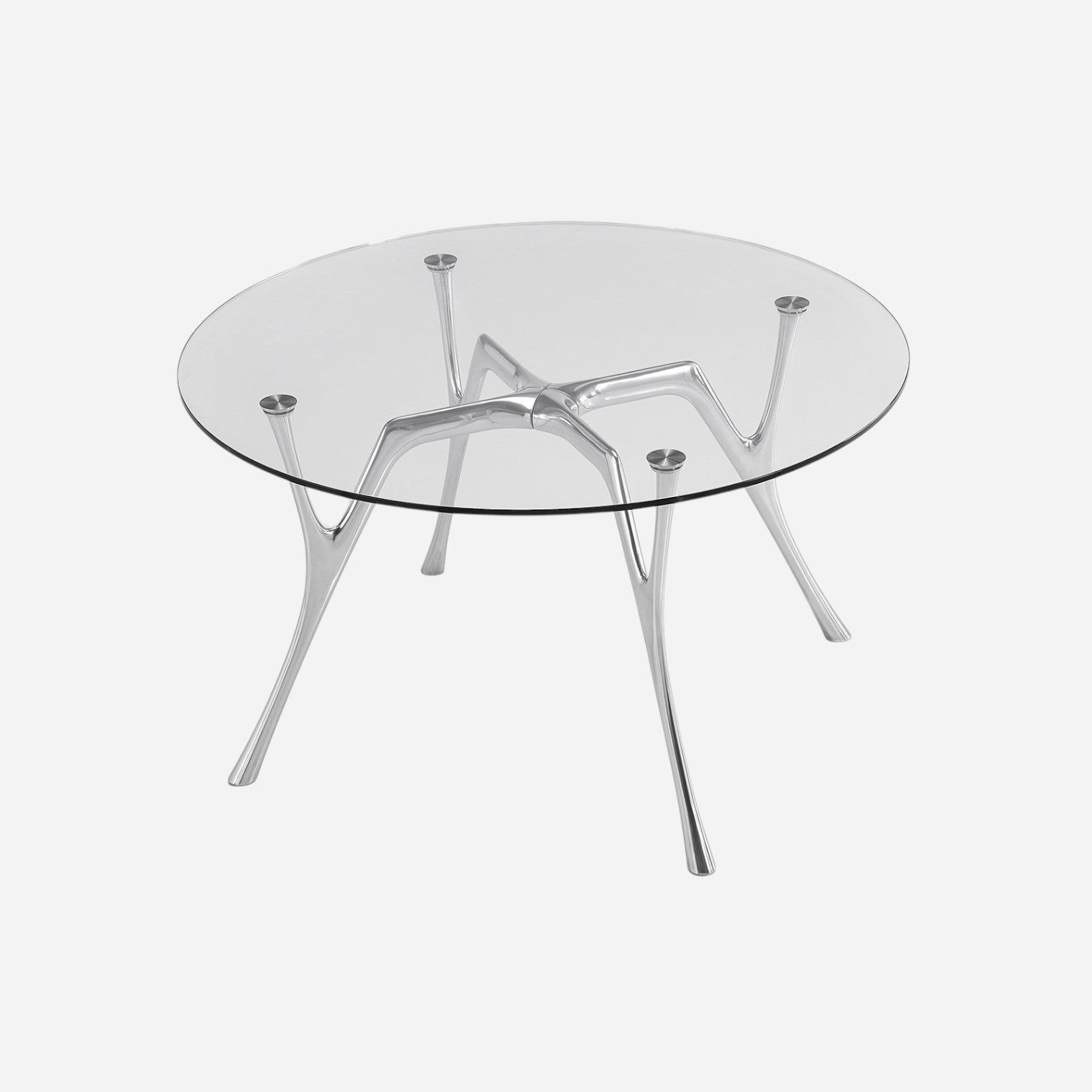 Addo Shop Pegaso round dining table with a clear tempered glass top and a sculptural polished aluminum base.