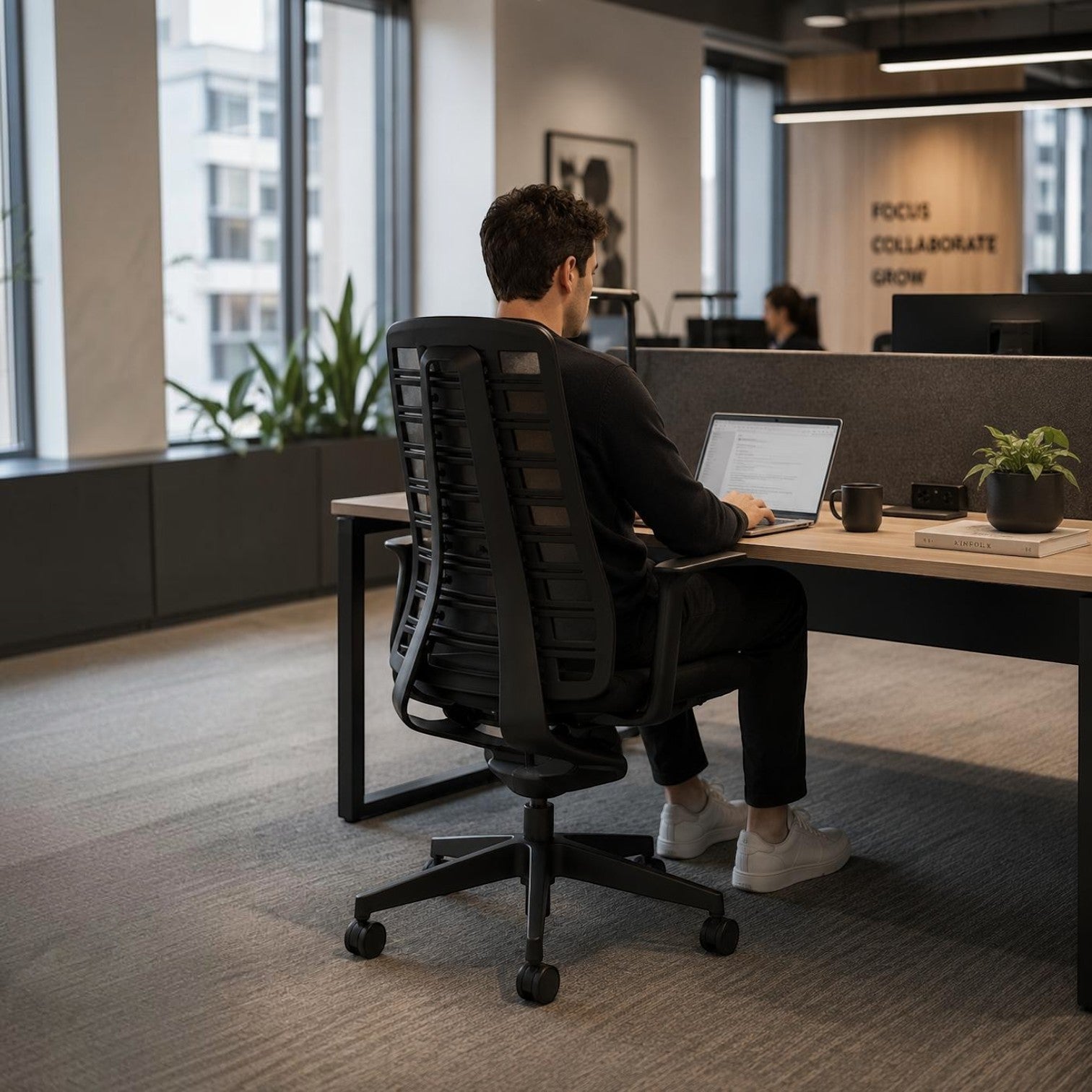 Addo Shop Pure ergonomic office chair with black FlexGrid backrest and upholstered seat in a modern workspace.