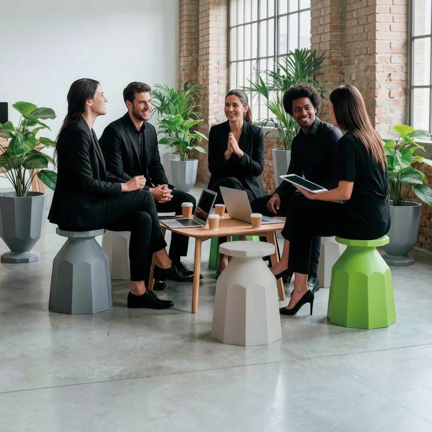 Addo Shop Rerecycled Stools in grey, white, and green, used as modern office seating by a group of professionals.