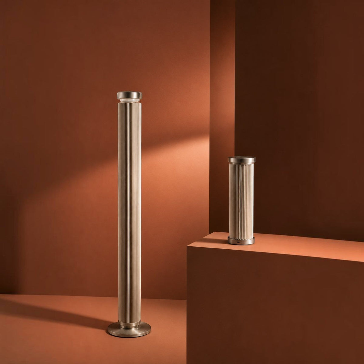 Addo Shop tall and short cylindrical floor lamps with ribbed beige fabric shades and brushed metal bases
