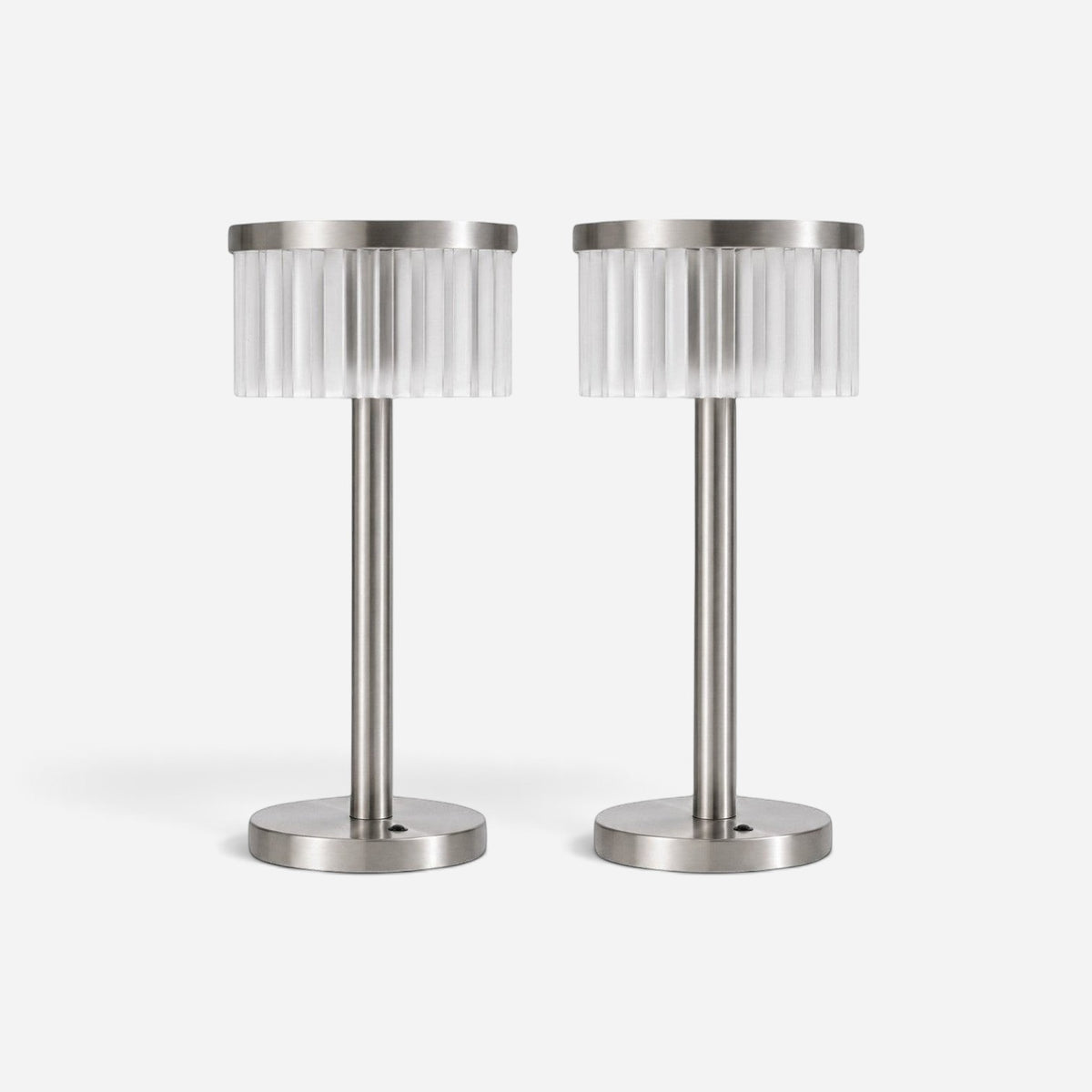 Addo Shop ŞEMS-1 brushed aluminum table lamps with cylindrical fluted glass shades for a soft, balanced glow.