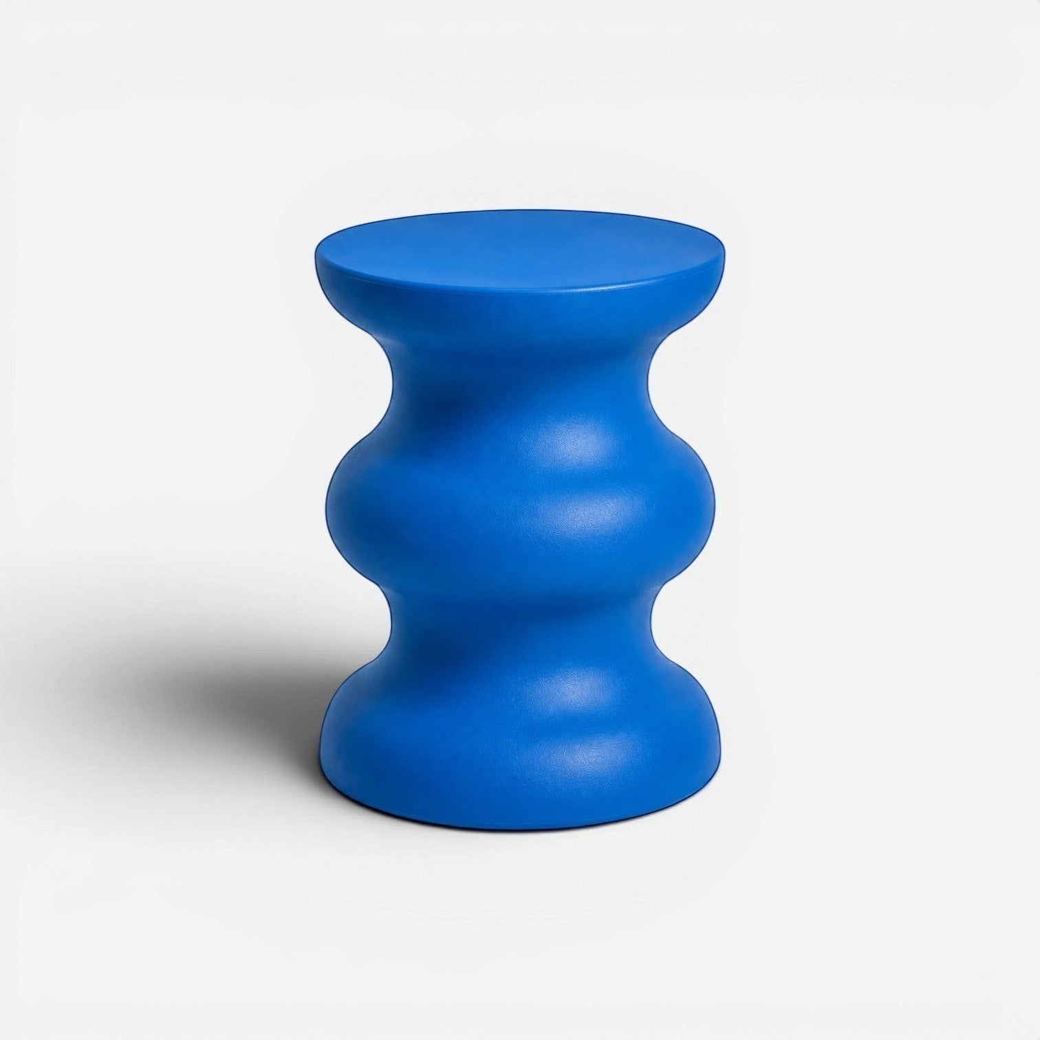 Addo Shop STILEMI Sculptural stool in vibrant blue with a modern, curved hourglass silhouette.