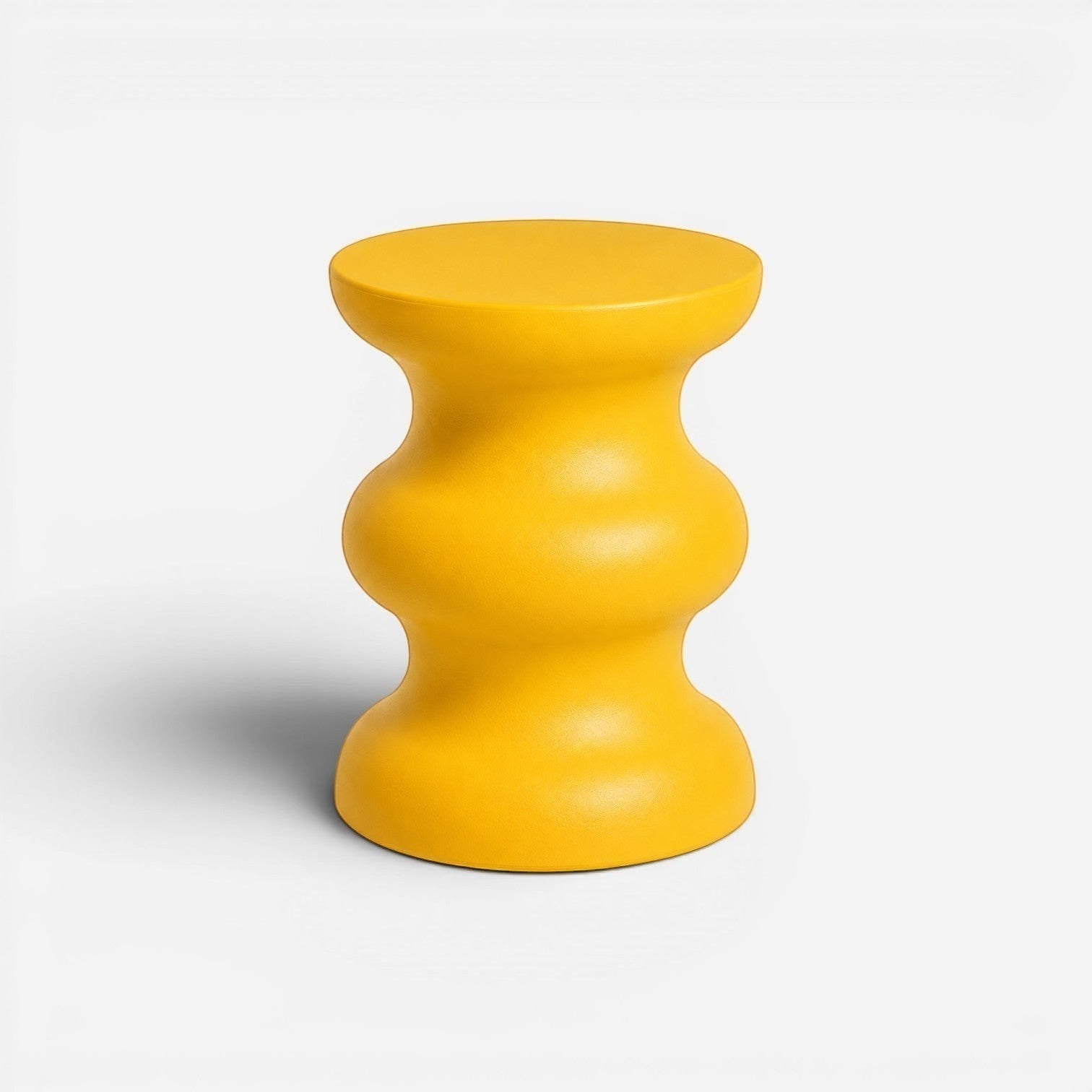 Addo Shop STILEMI Sculptural stool in vibrant yellow with a modern, curved hourglass silhouette.