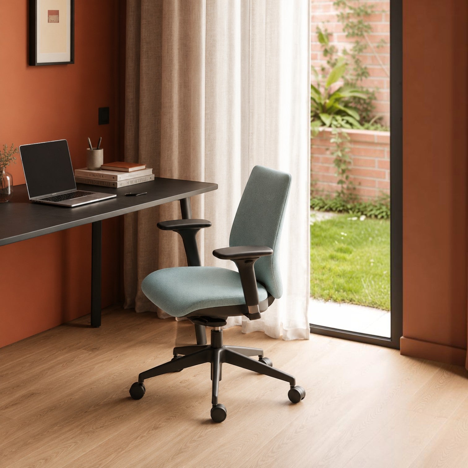 Addo Shop T-MAX office chair with light blue upholstered seat and back, black frame, and adjustable armrests in office
