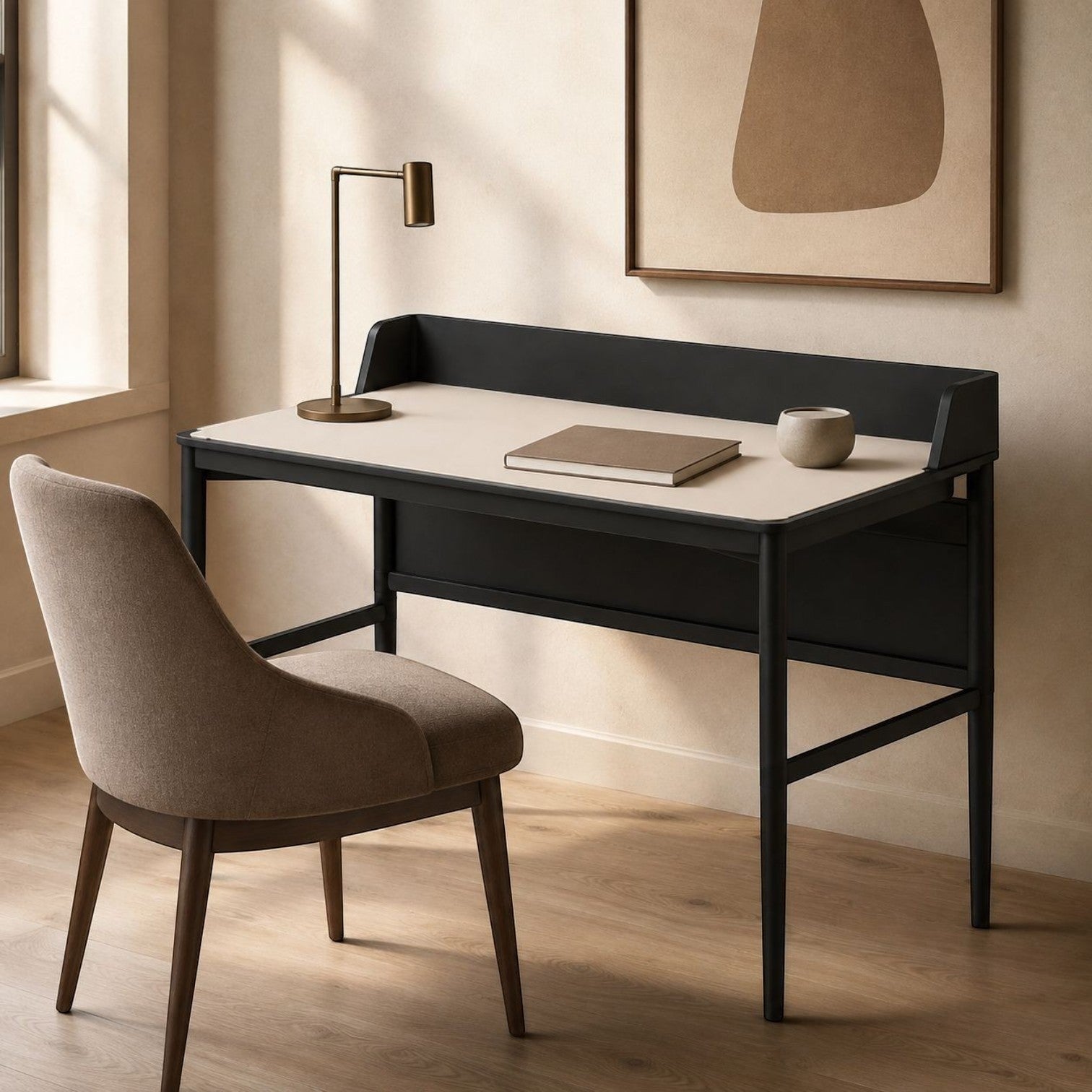 Addo Shop Urfa Hilton desk with black frame, light surface, and raised back edge, paired with a modern fabric chair.