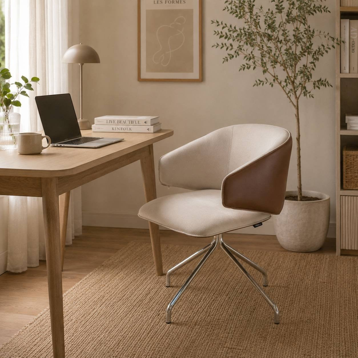 Addo Shop Wing Low lounge chair with beige fabric, brown leather accents, and a chrome wire base in a modern office.