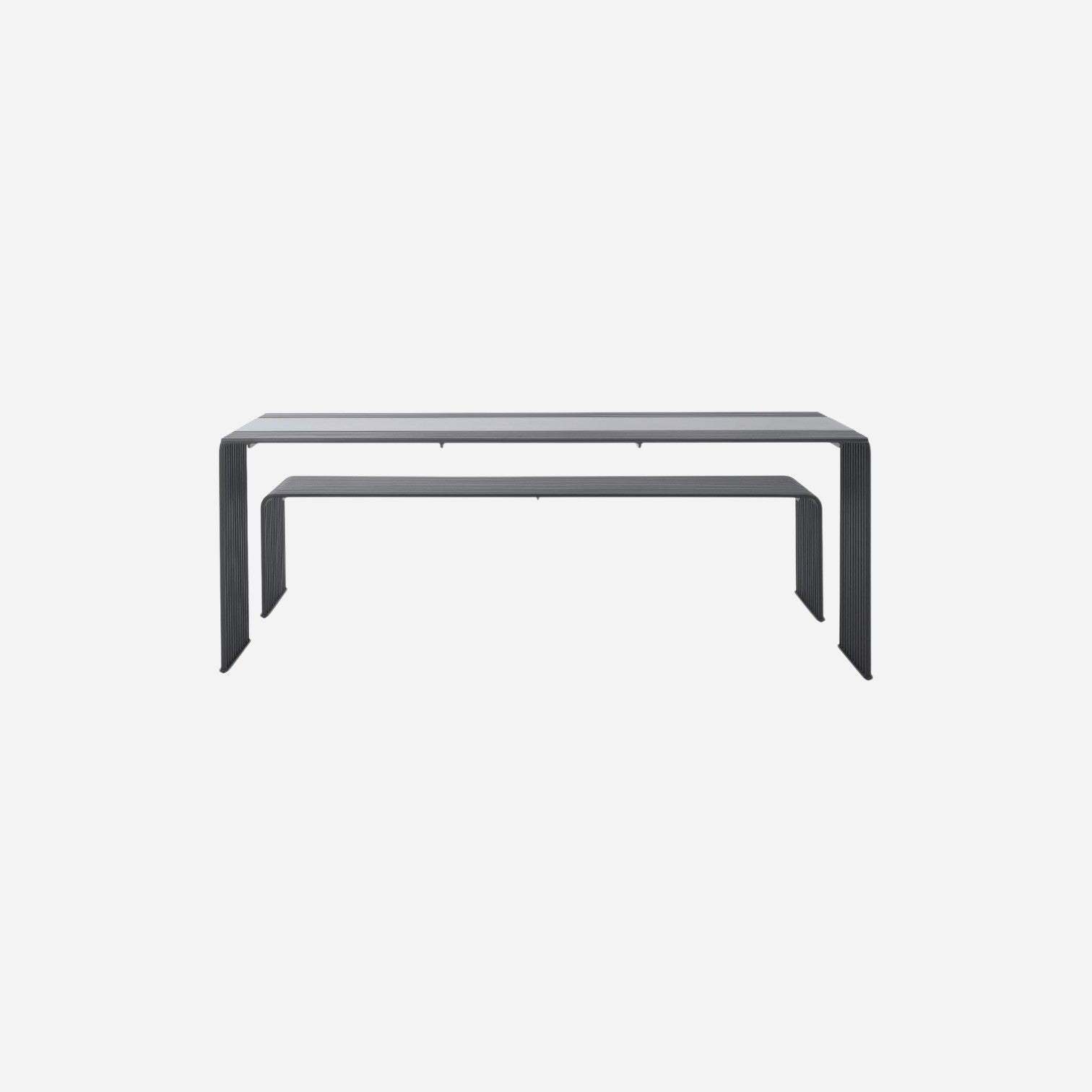 Addo Shop Zeroquindici .015 modern minimalist dining table in dark grey with a sleek ribbed metal frame design.