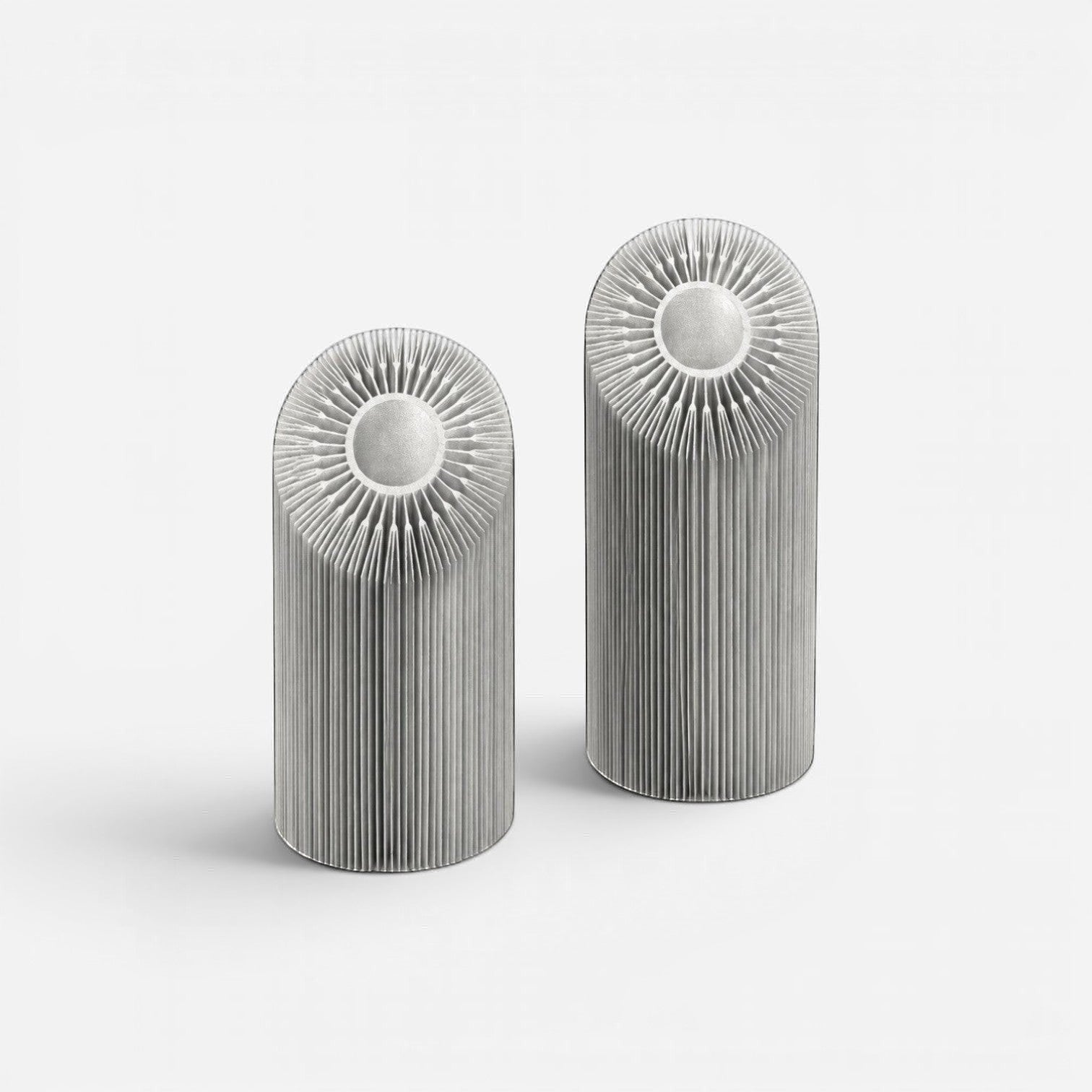 Addo Shop silver aluminum cylindrical heatsinks with radial fins for electronics cooling. Efficient heat dissipation.