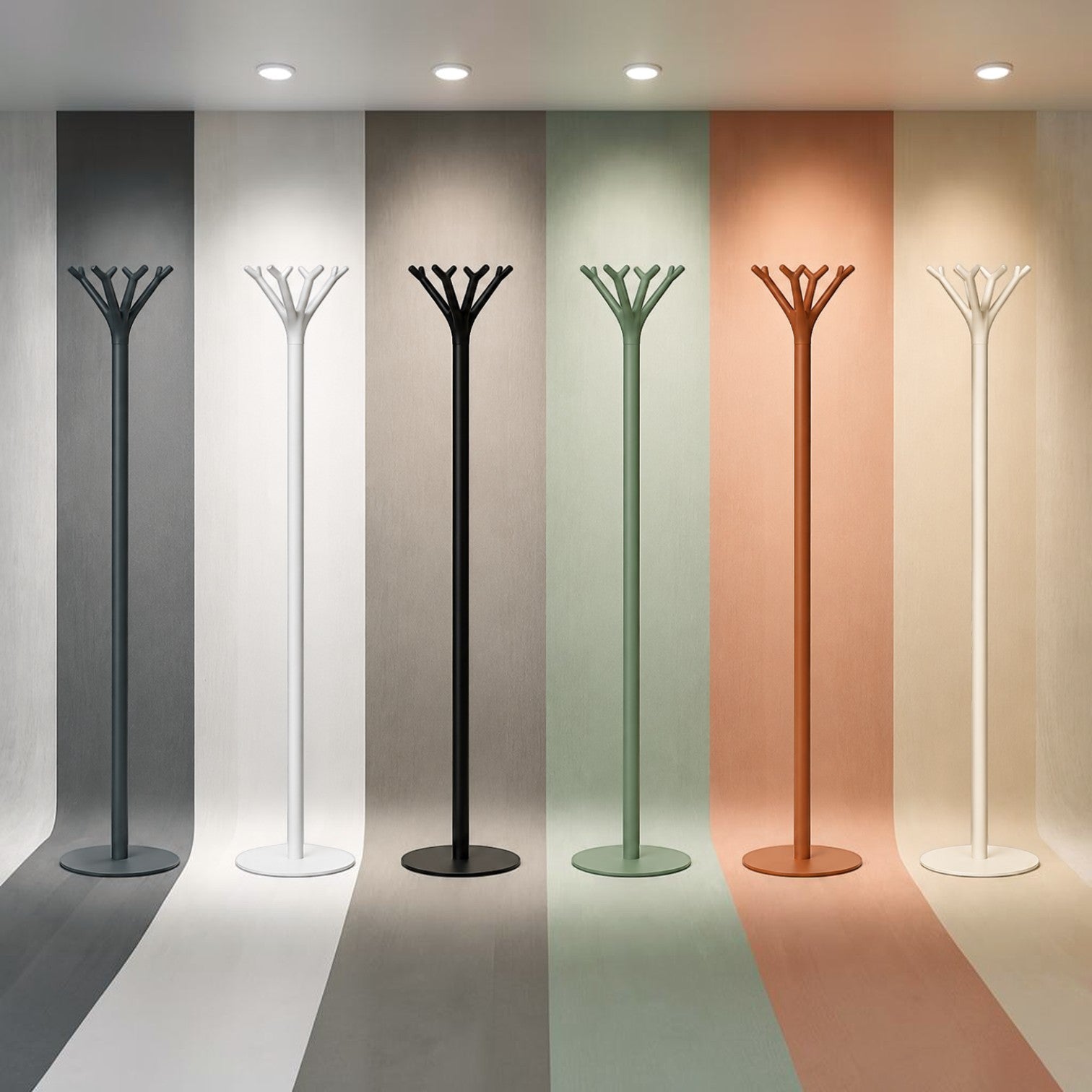 Addo Shop Battista coat stand in dark grey, white, black, sage green, terracotta, and beige. Modern tree-like design.
