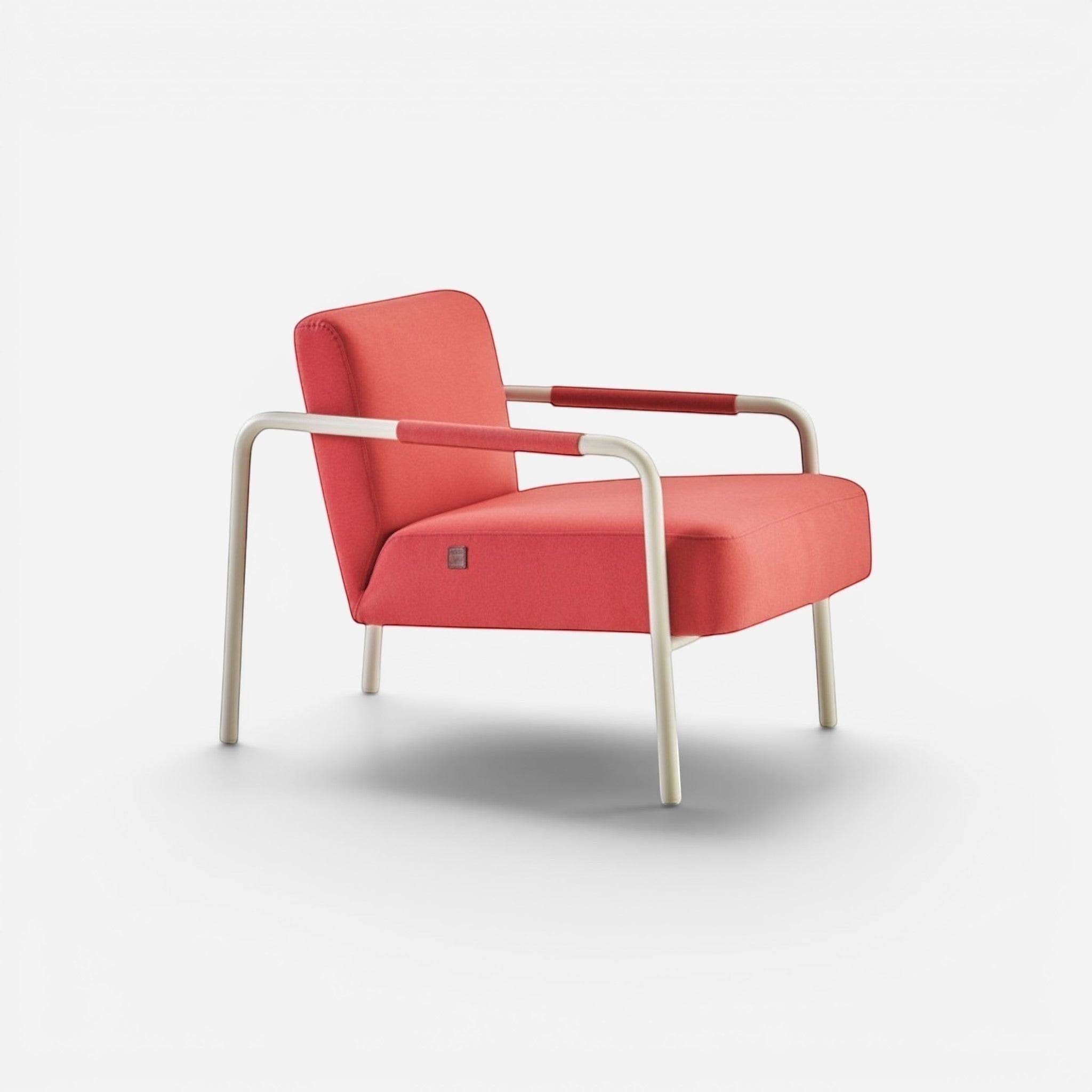 Addo Shop Bia armchair in coral fabric with faux leather armrests and light grey metal legs. Modern accent chair.