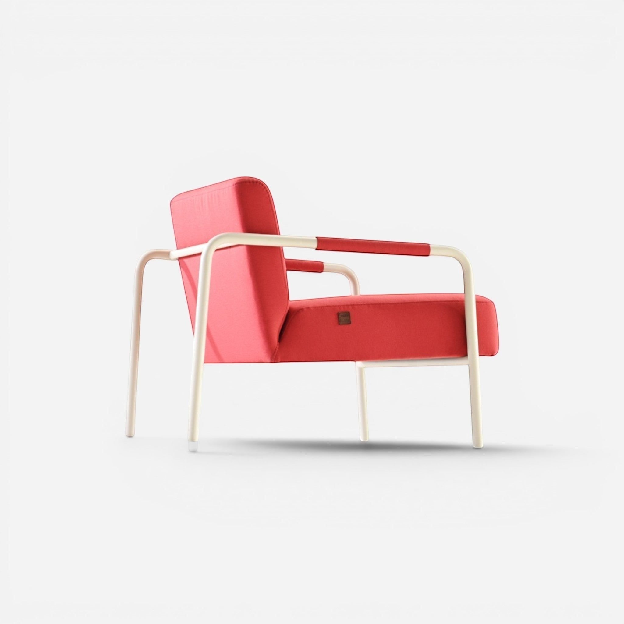 Addo Shop Bia armchair in coral red fabric with white metal frame and faux leather armrests. Modern lounge chair.