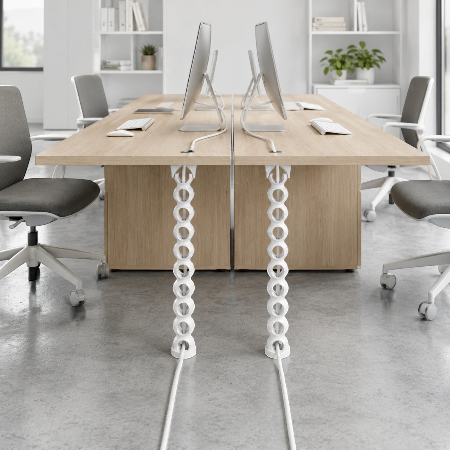 Addo Shop white flexible BISS cable holder attached to a wooden desk, organizing computer wires.
