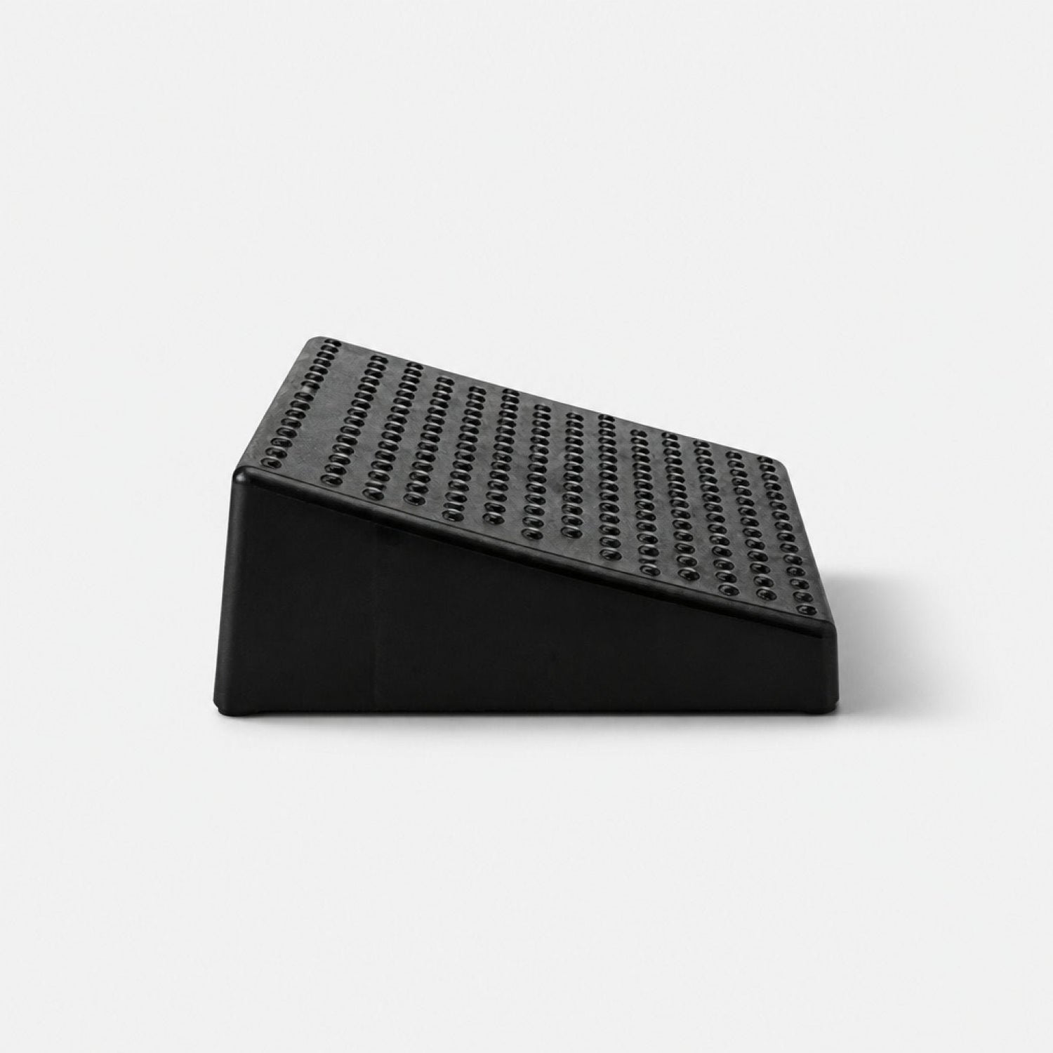 Addo Shop RIPOSO black ergonomic footrest with textured surface for grip and comfort.