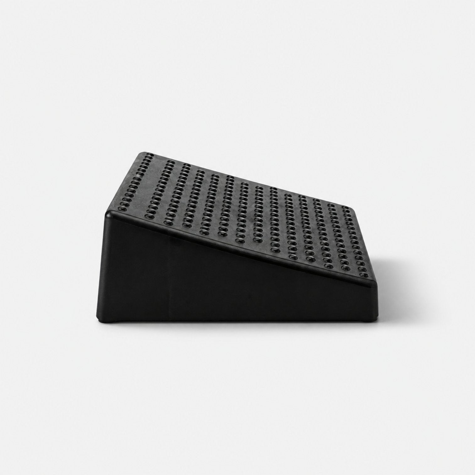 Addo Shop RIPOSO black ergonomic footrest with textured surface for grip and comfort.