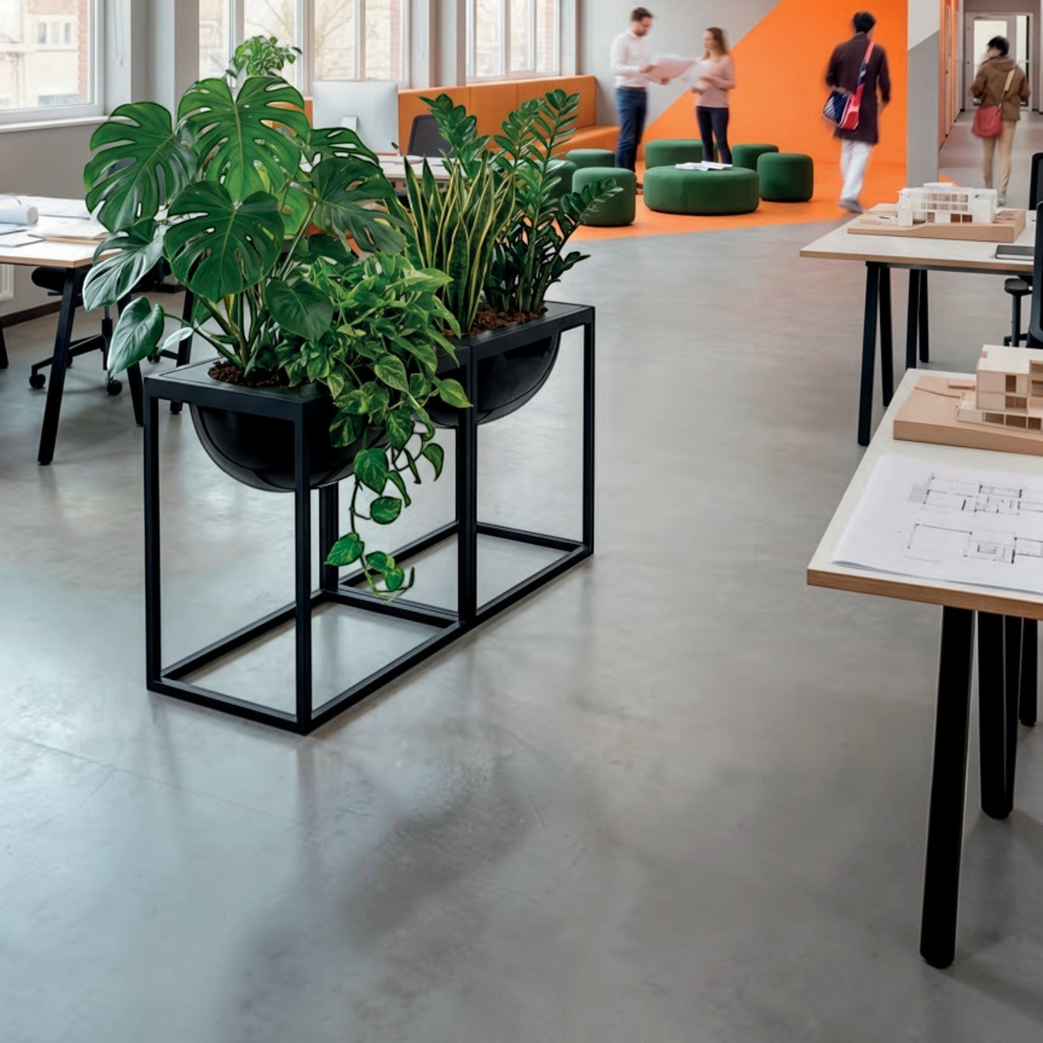 Addo Shop Florianopolis Planter 59, a modern black metal planter with two large black bowls filled with lush green plants, including Monstera and Pothos.