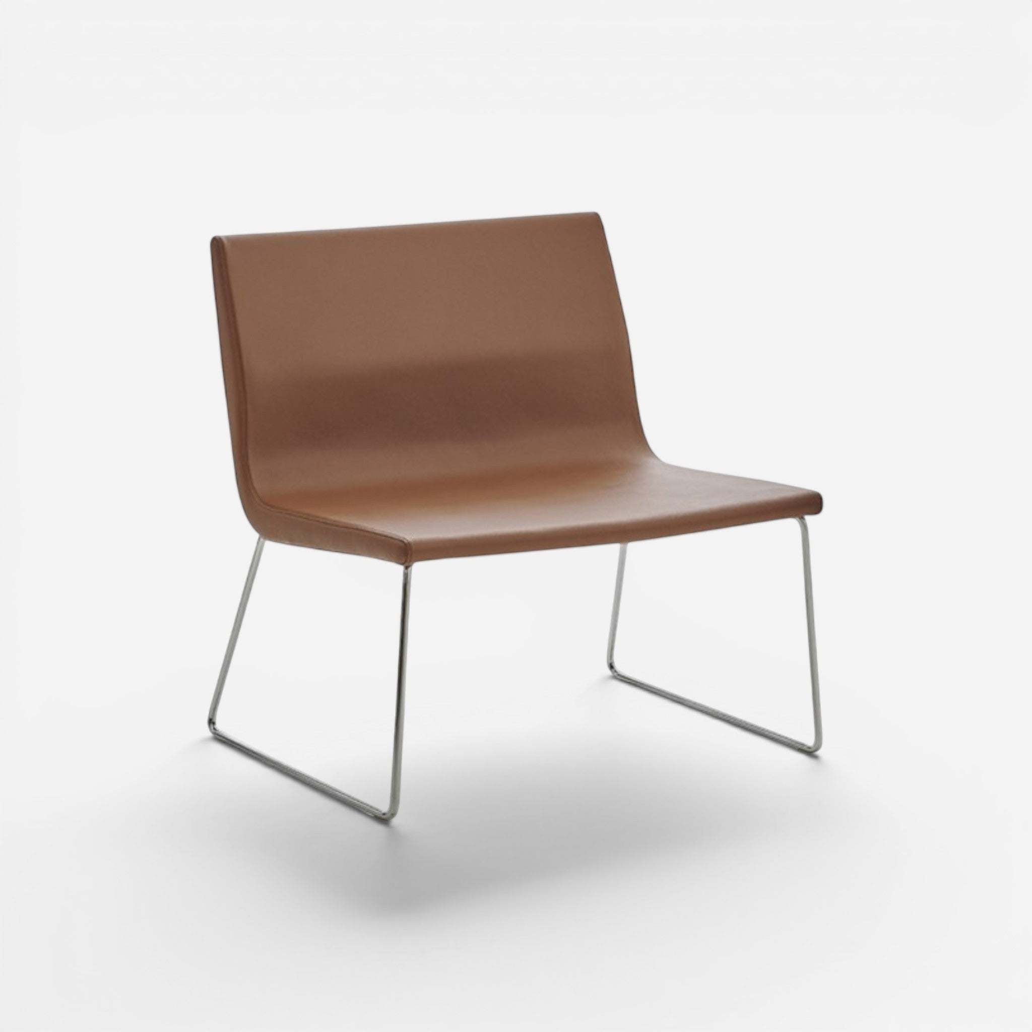 Addo Shop Godot lounge chair in brown faux leather with chrome metal legs and swivel mechanism.