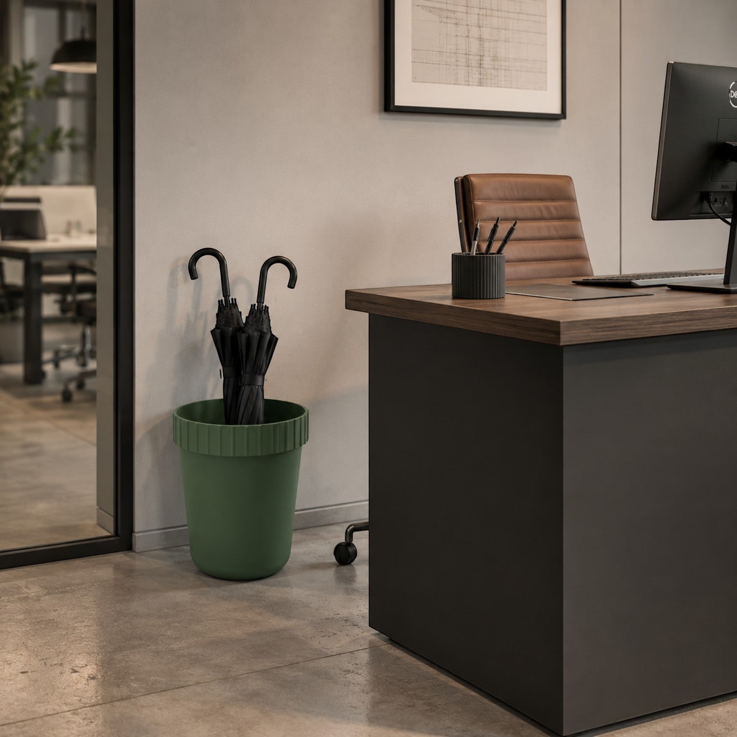 Addo Shop green plastic Raffles System umbrella stand holding black umbrellas in an office.