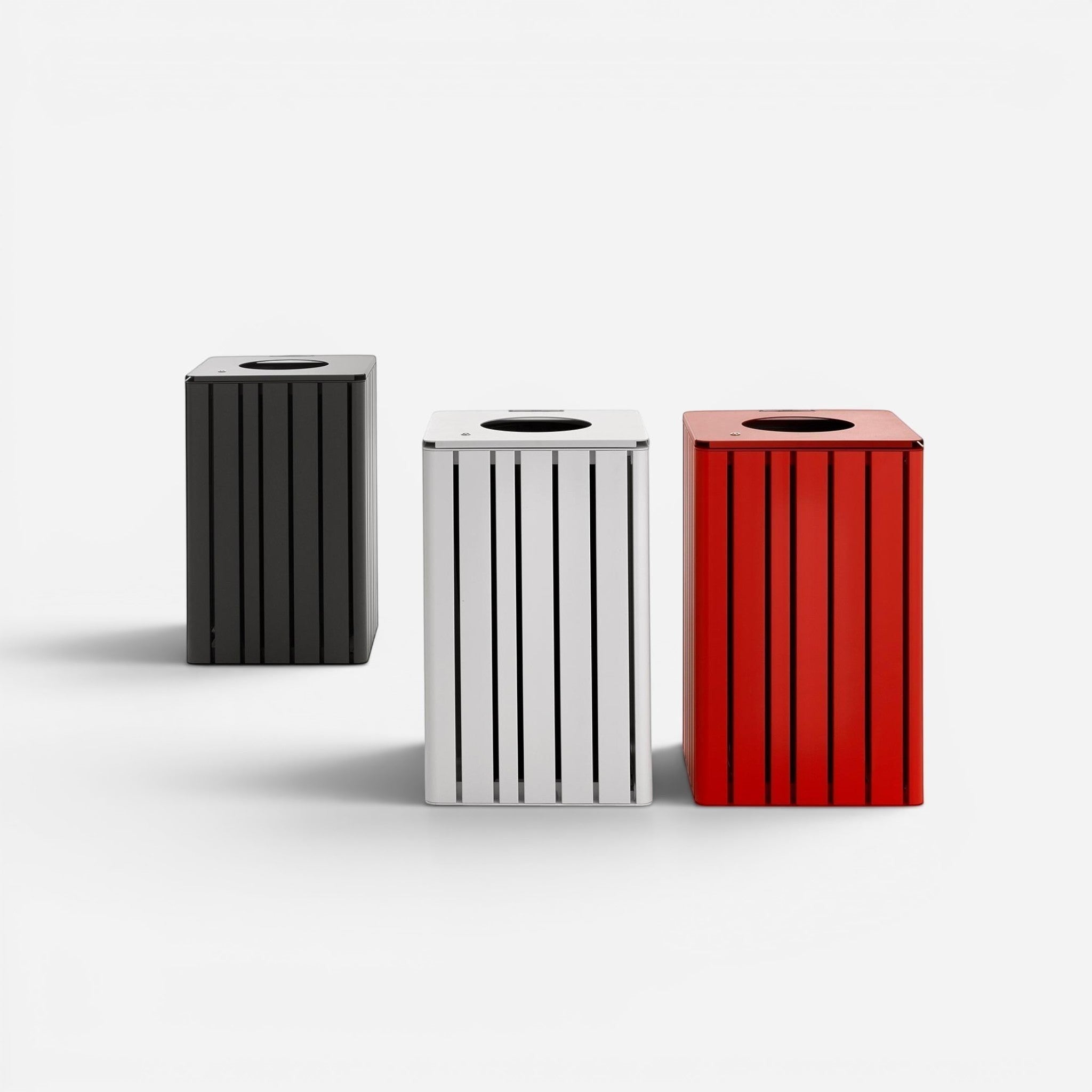 Addo Shop h24 litter bins in black, white, and red. Modern steel outdoor trash cans with vertical slats and a top opening.