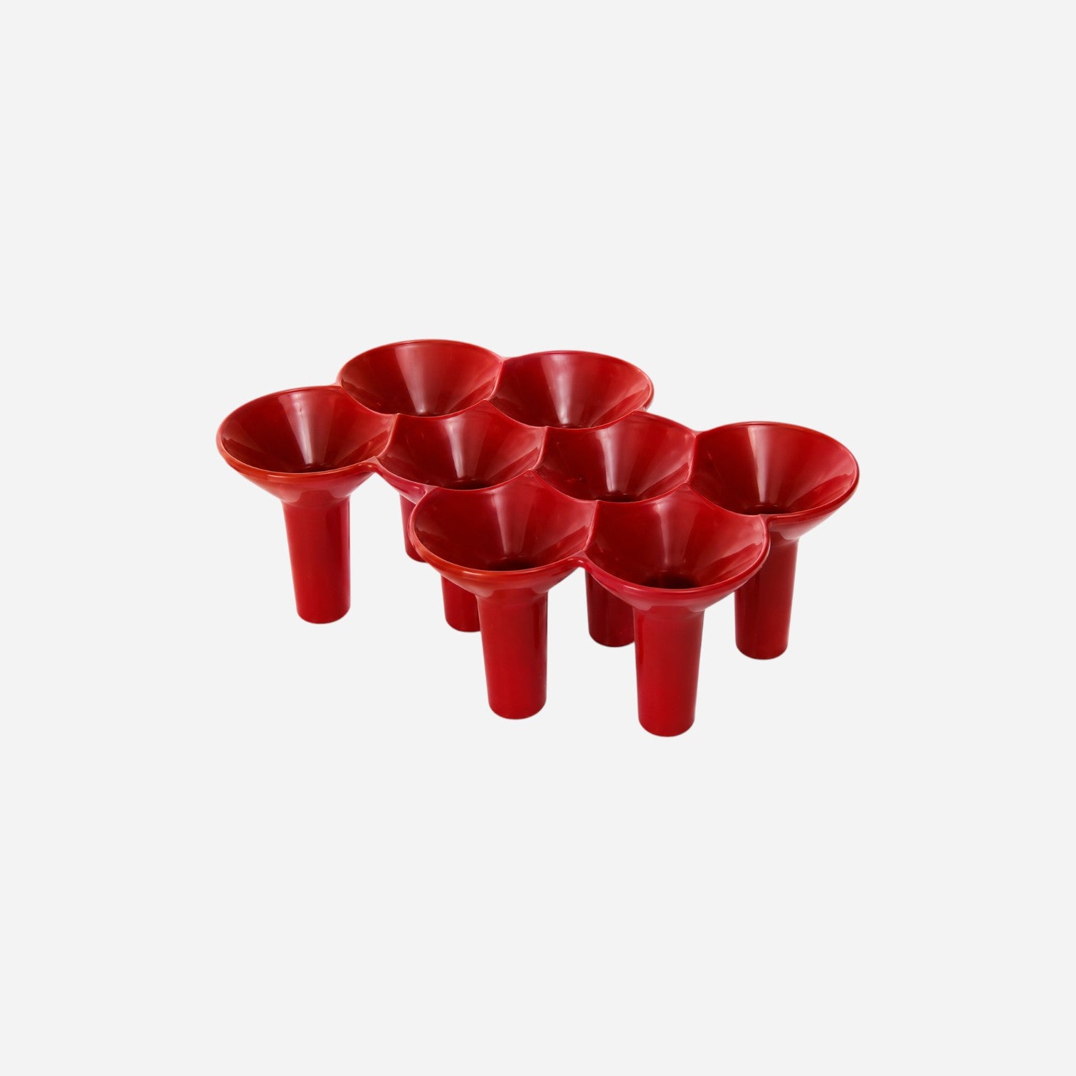 Addo Shop KABO red plastic umbrella stand with 7 slots for organizing umbrellas.