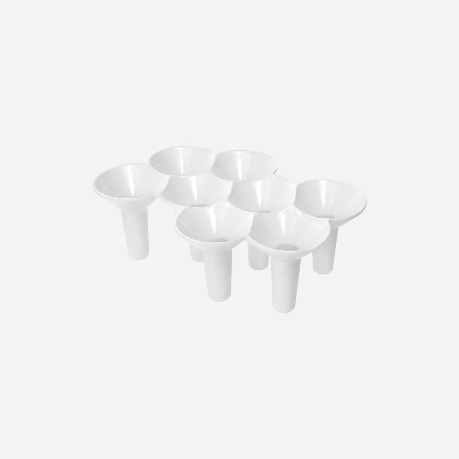 Addo Shop white plastic KABO umbrella stand with 7 slots for organizing umbrellas.
